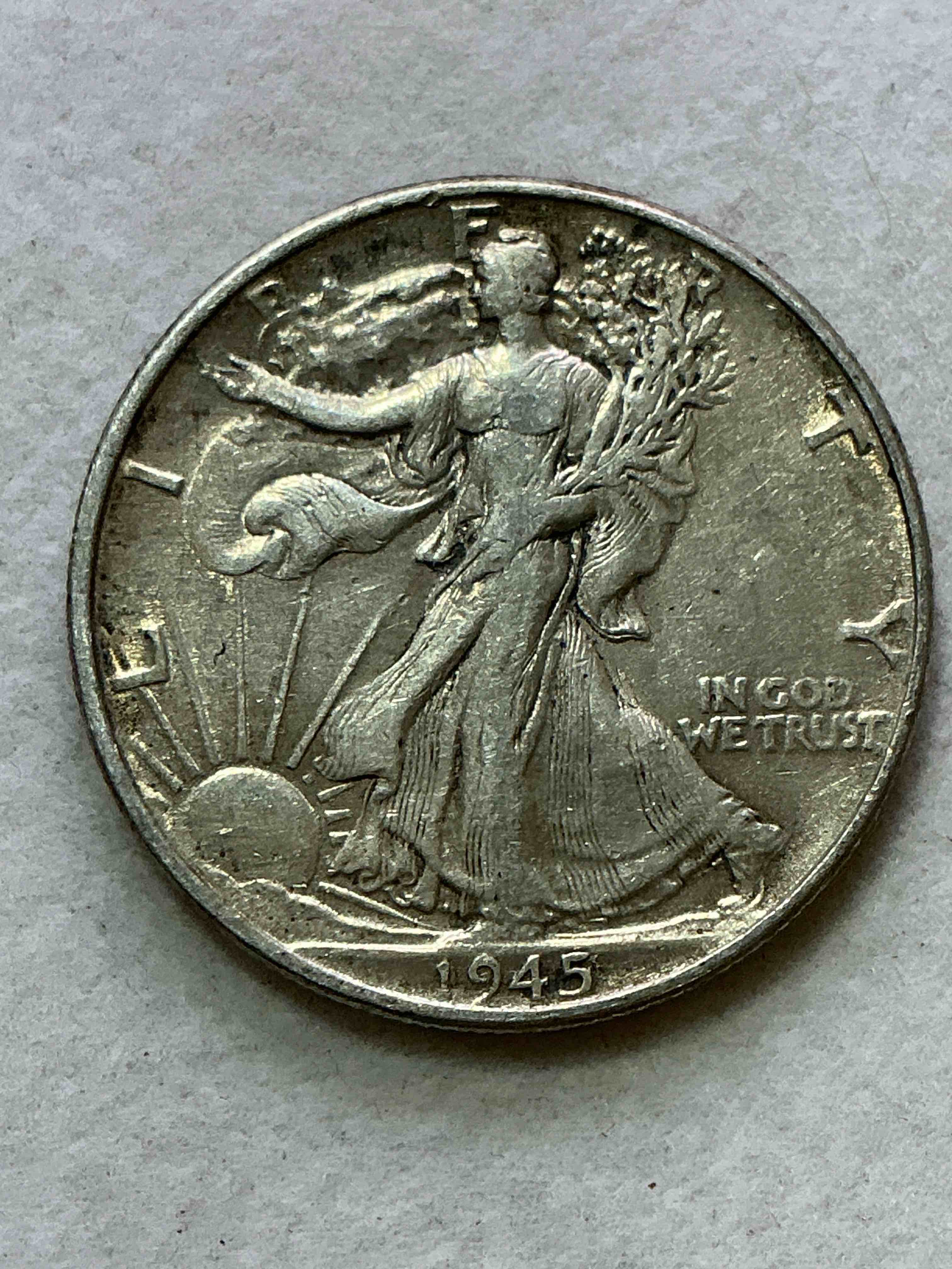 world war ii era silver! antique u.s. silver! stunning uncirculated liberty walking silver half dollars! these striking half dollars were minted from 1916-1947 & have become some of the most collectible coins in history! here is a striking uncirculated example from 1945! liberty walking coins are 90% fine u.s. silver, a great investment in precious metal!