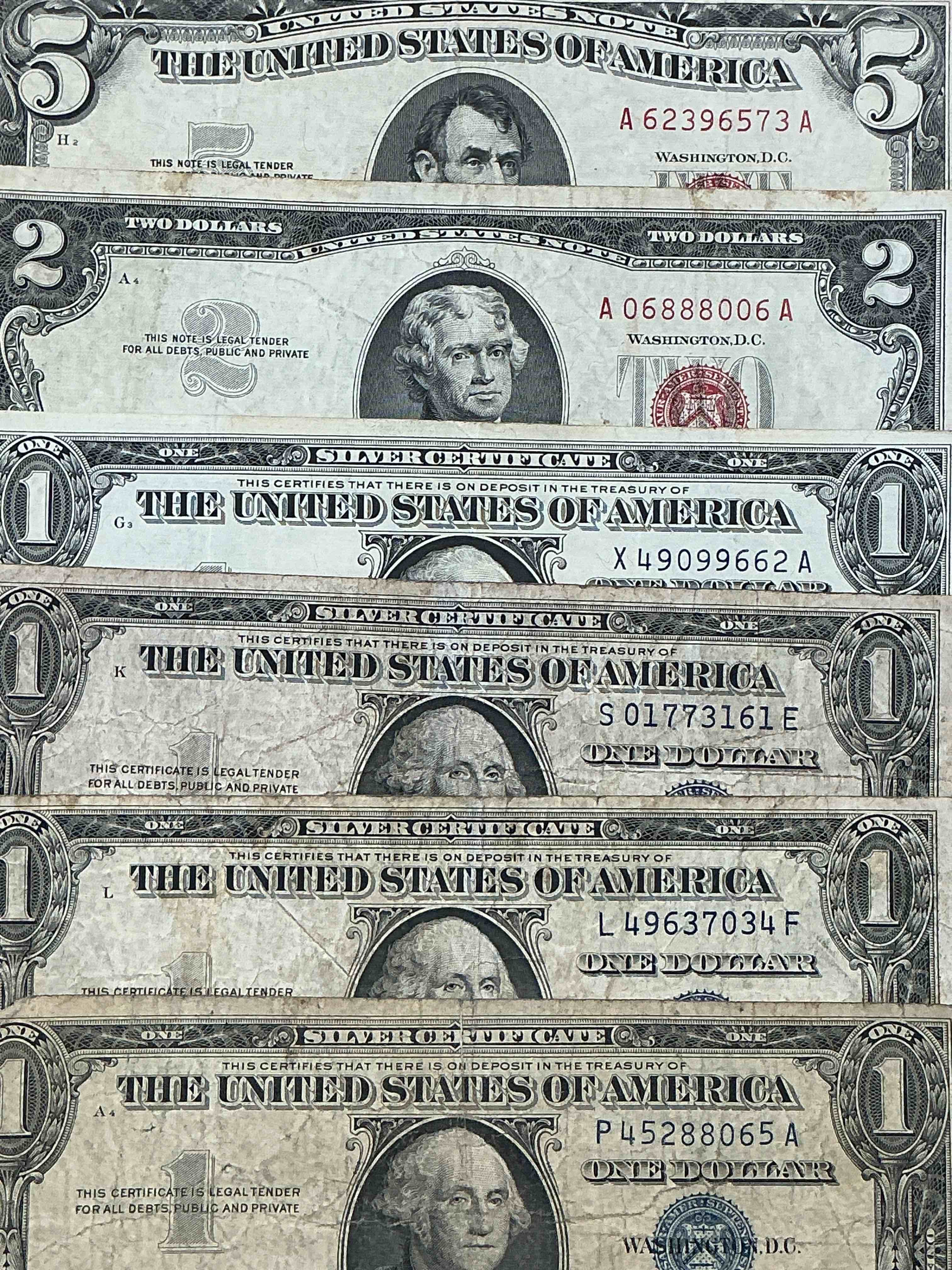 Rare American Dollar Bills! RED Seal Five Dollar Bill & Red Seal Two Dollar Bill, Along With Silver Certificates! Five Dollar Bill Ultra Rare & In Good Condition, Red Seal Two Dollar Bill In Good Condition & Silver Certificates Produced From 1878 To 1964 & Are Still Considered Legal Tender At Face Value. Here Are Gorgeous, Circulated 1935 & 1957 U.S. One Dollar Silver Certificate, With Highly Collectible "Blue Seal!* Own An Awesome Piece Of History! American Dollar Lot! 