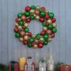 Artificial Christmas wreath with gold green and red ornaments