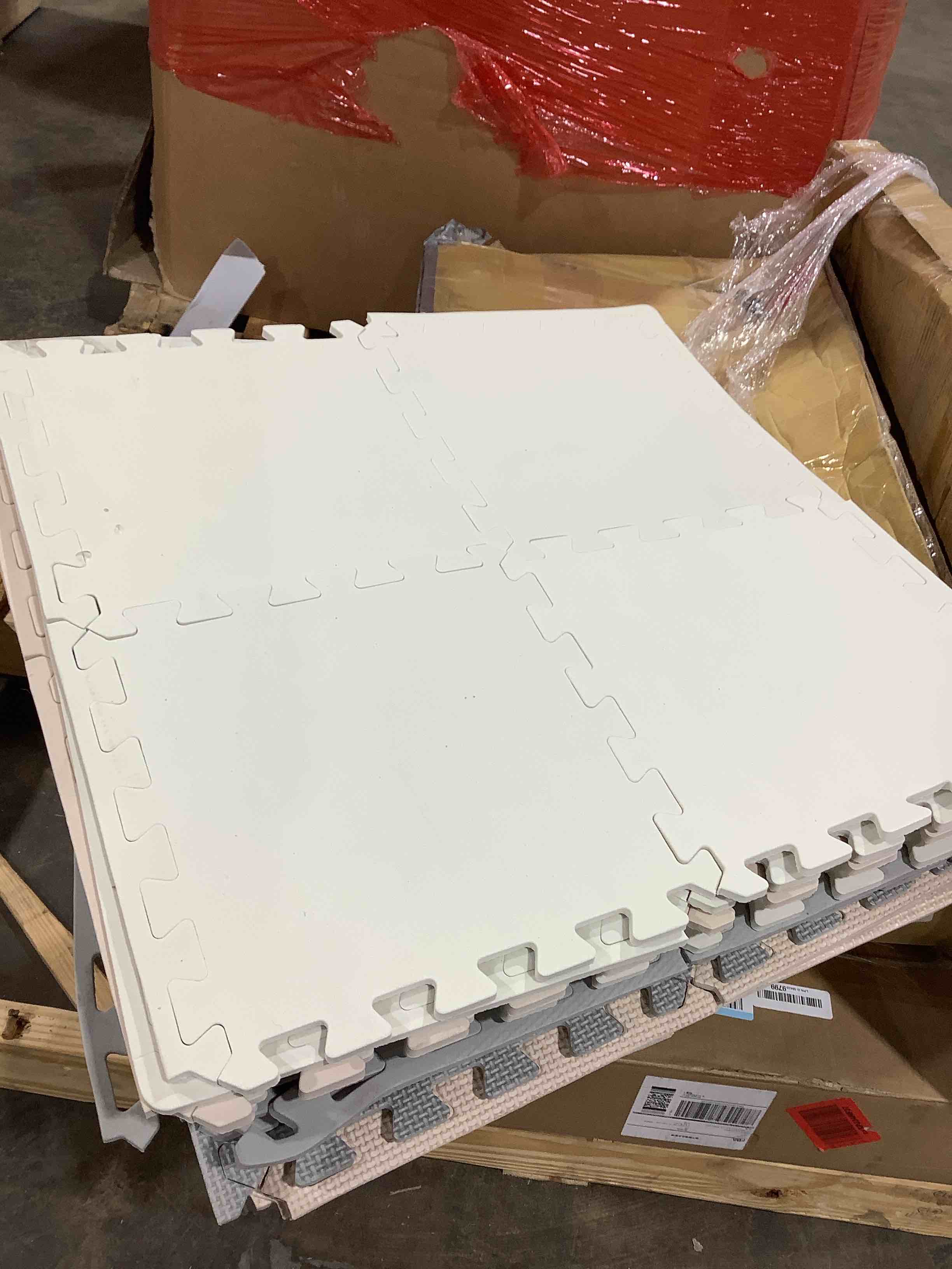 Condition photo showing As Is for Assortment of 24" x 24" floor protectors soft sponge like