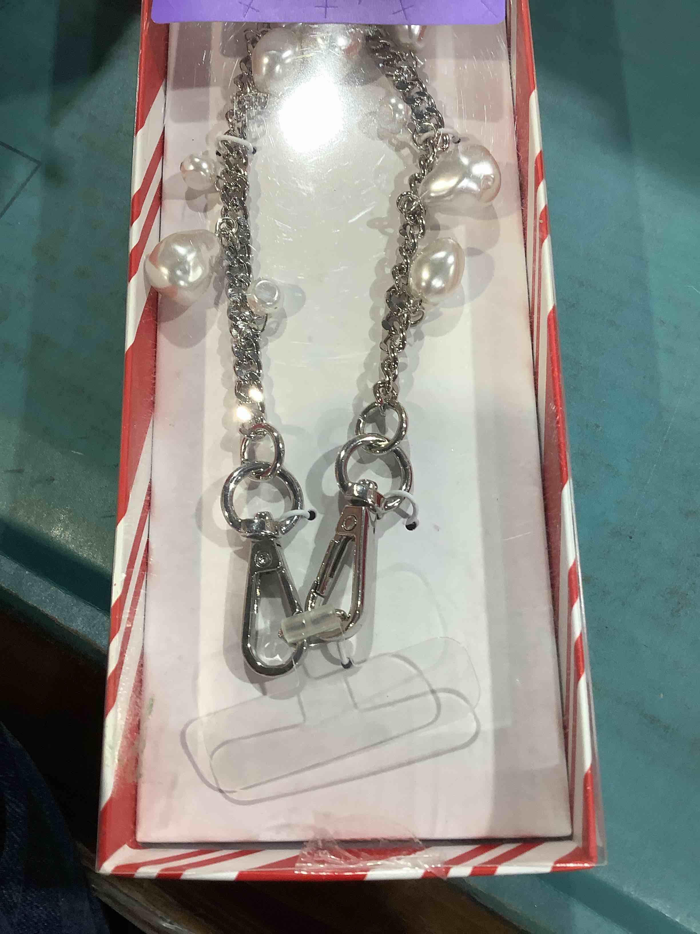 Condition photo showing New/Like New for A new day wristlet strap phone attachment included