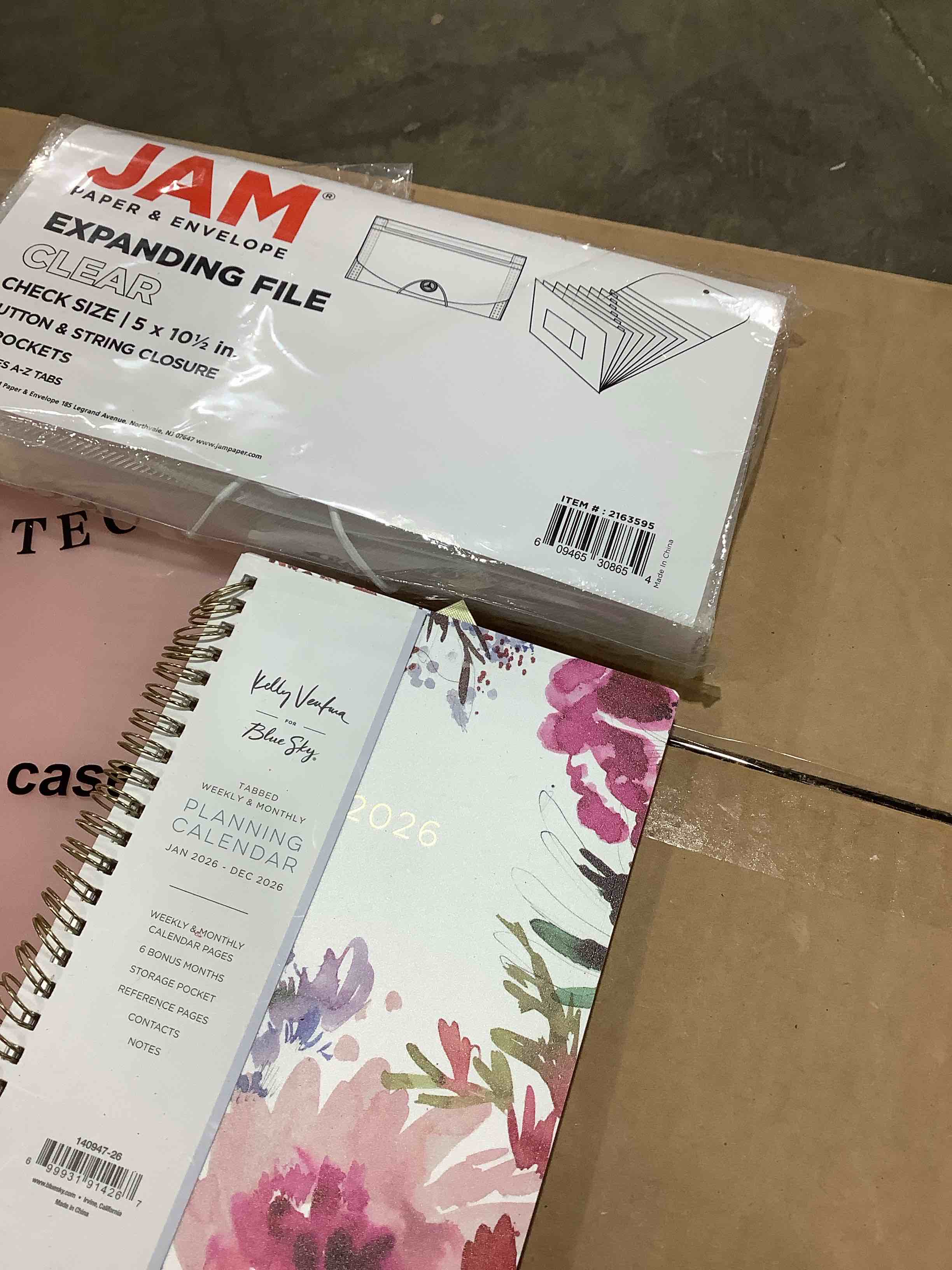 Condition photo showing New/Like New for assorted office supplies: expanding folder file, post tag notes, 2026 planning calendar, protective case