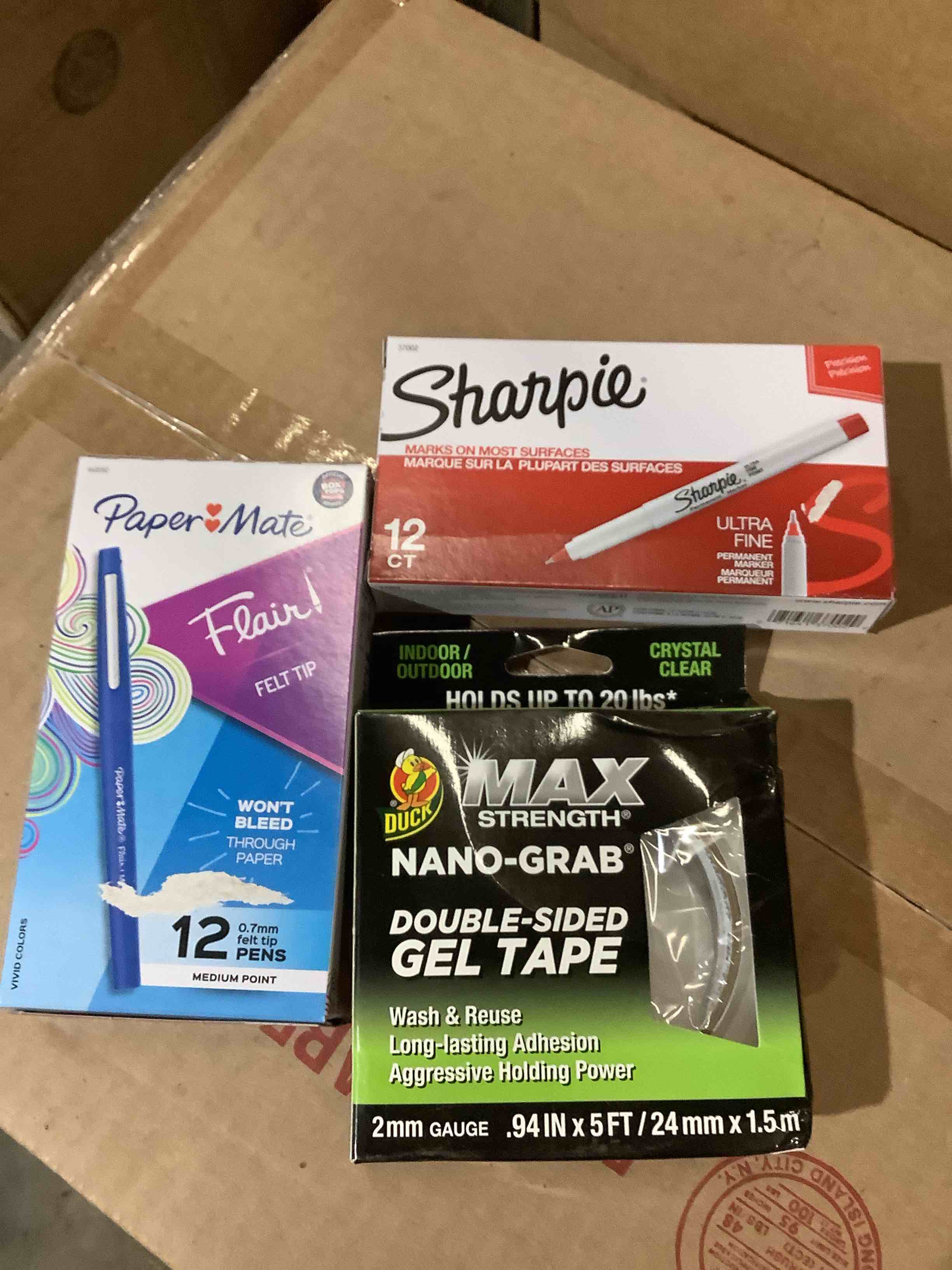  Assorted office supplies: sharpie, pens, paper, mate, pens, duck, maximum strength, double-sided