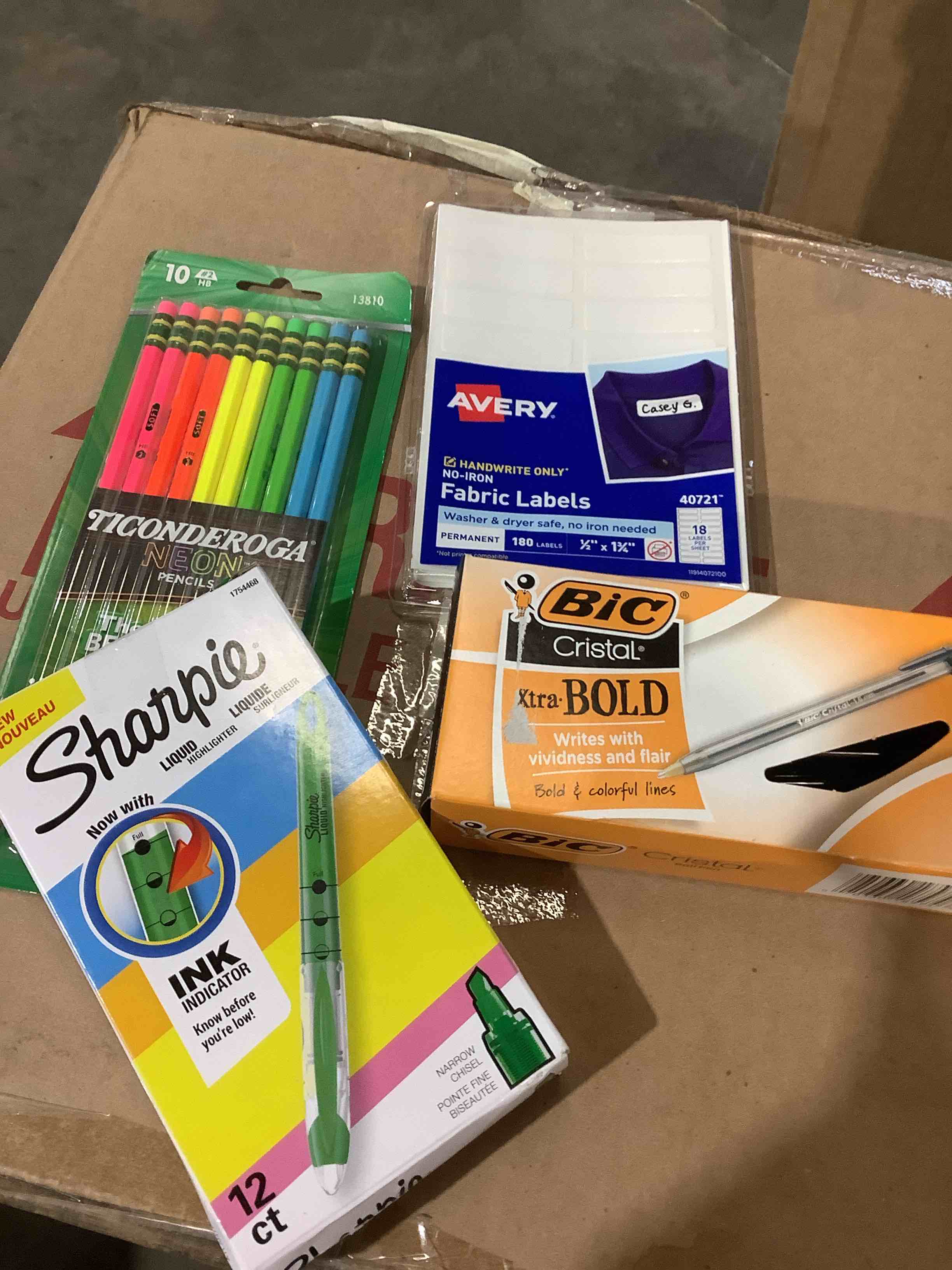 Assortment of office supplies: sharpies green, big, bold, pens, neon, pen, pencil