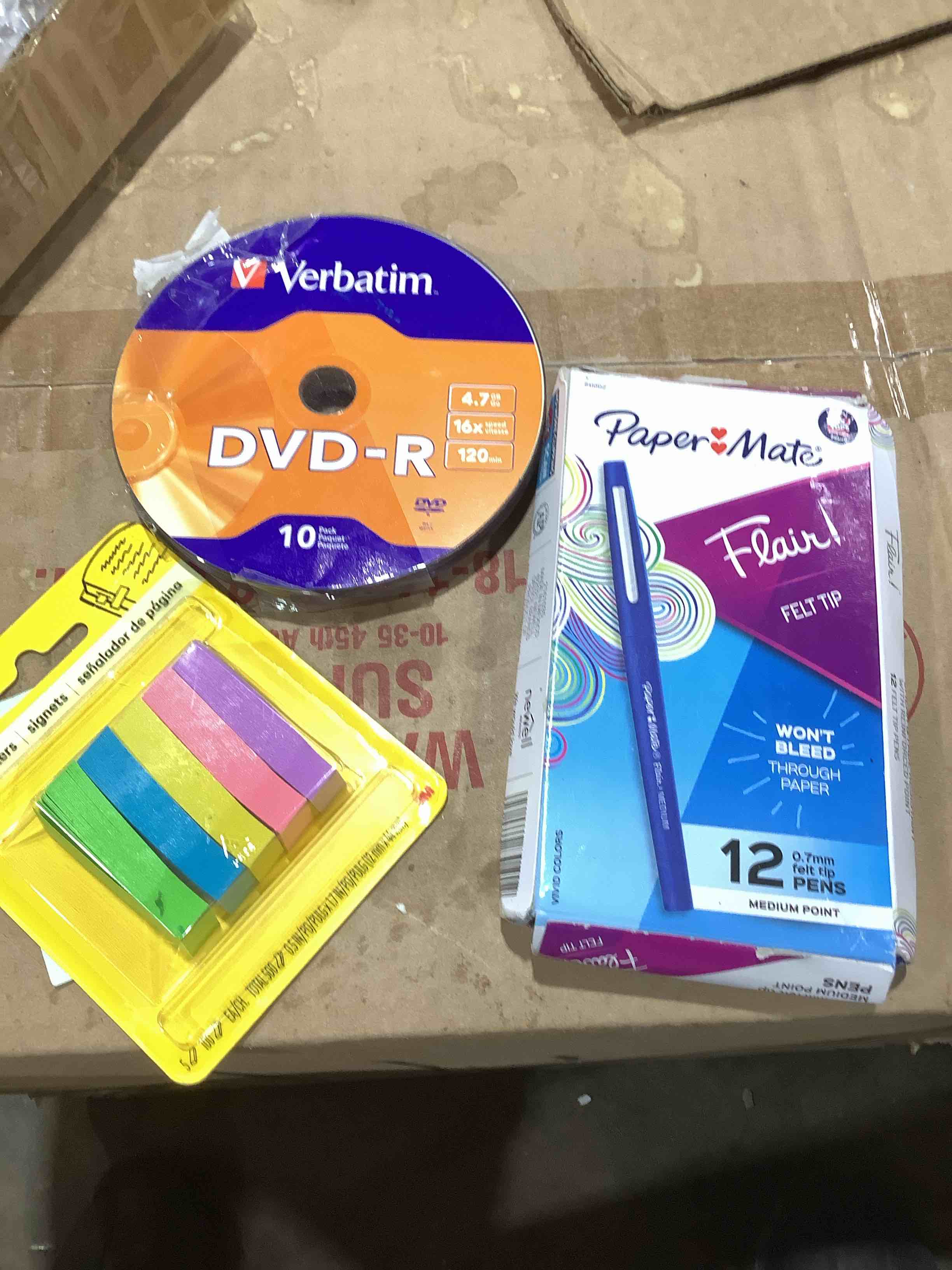 Assorted office supplies: paper mate flare felt tip pins, post page markers,Verbatim DVD – R