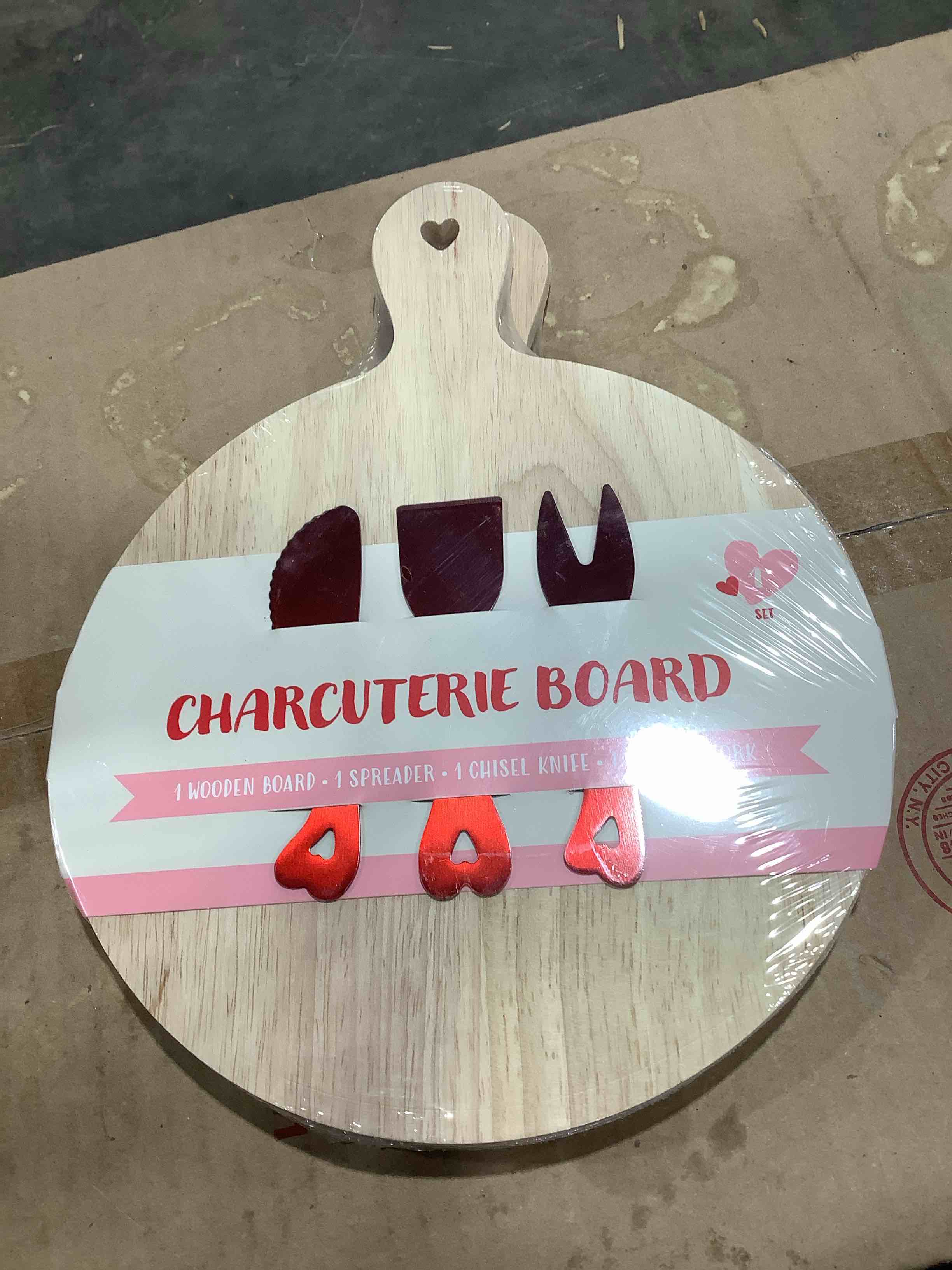 Charcuterie board with one wooden board, one spreader, one chisel knife, one serving fork