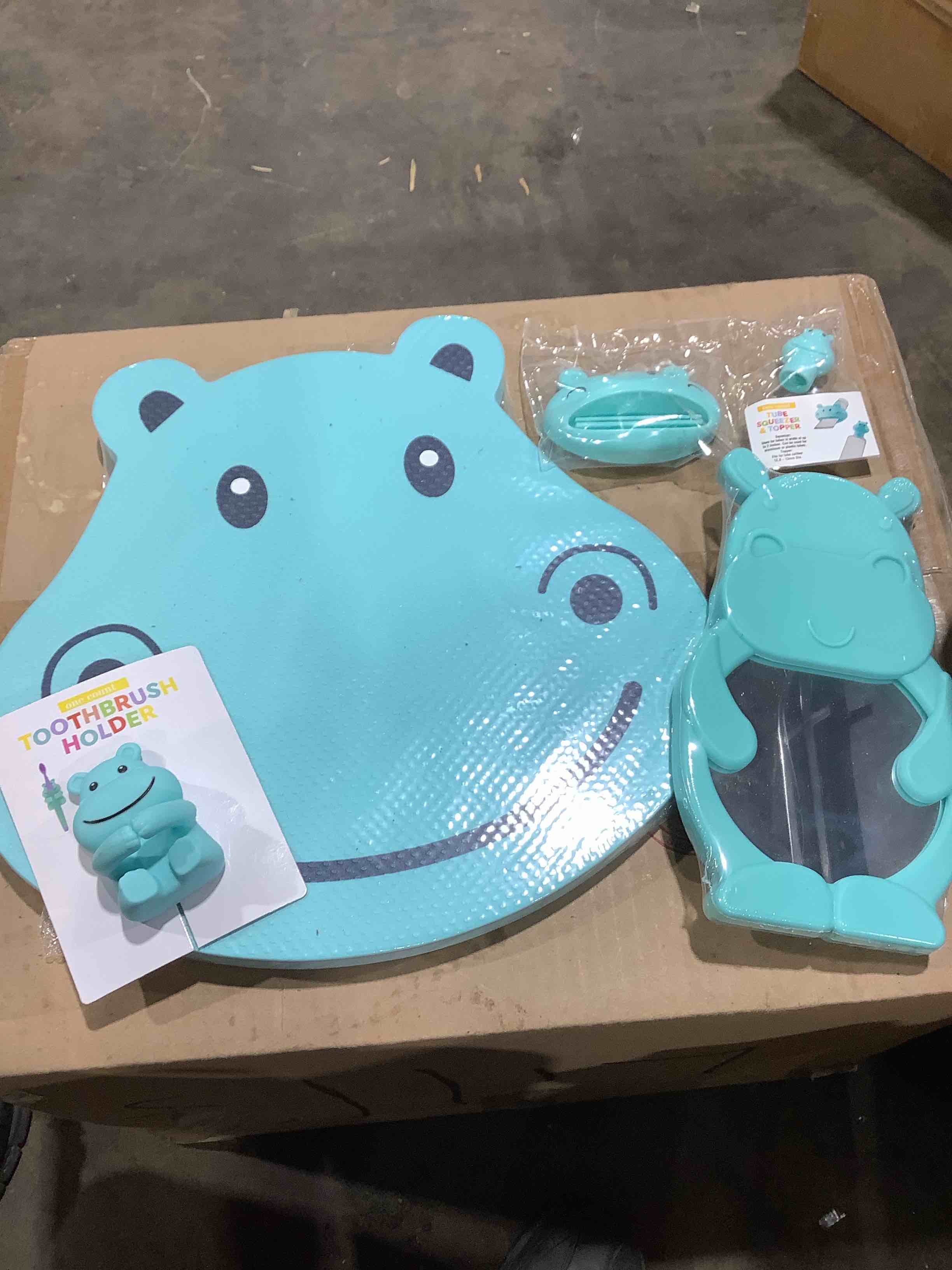 Hippo bathroom bath items: Toothbrush cover, kneeling pad, mirror, and tube squeeze and topper