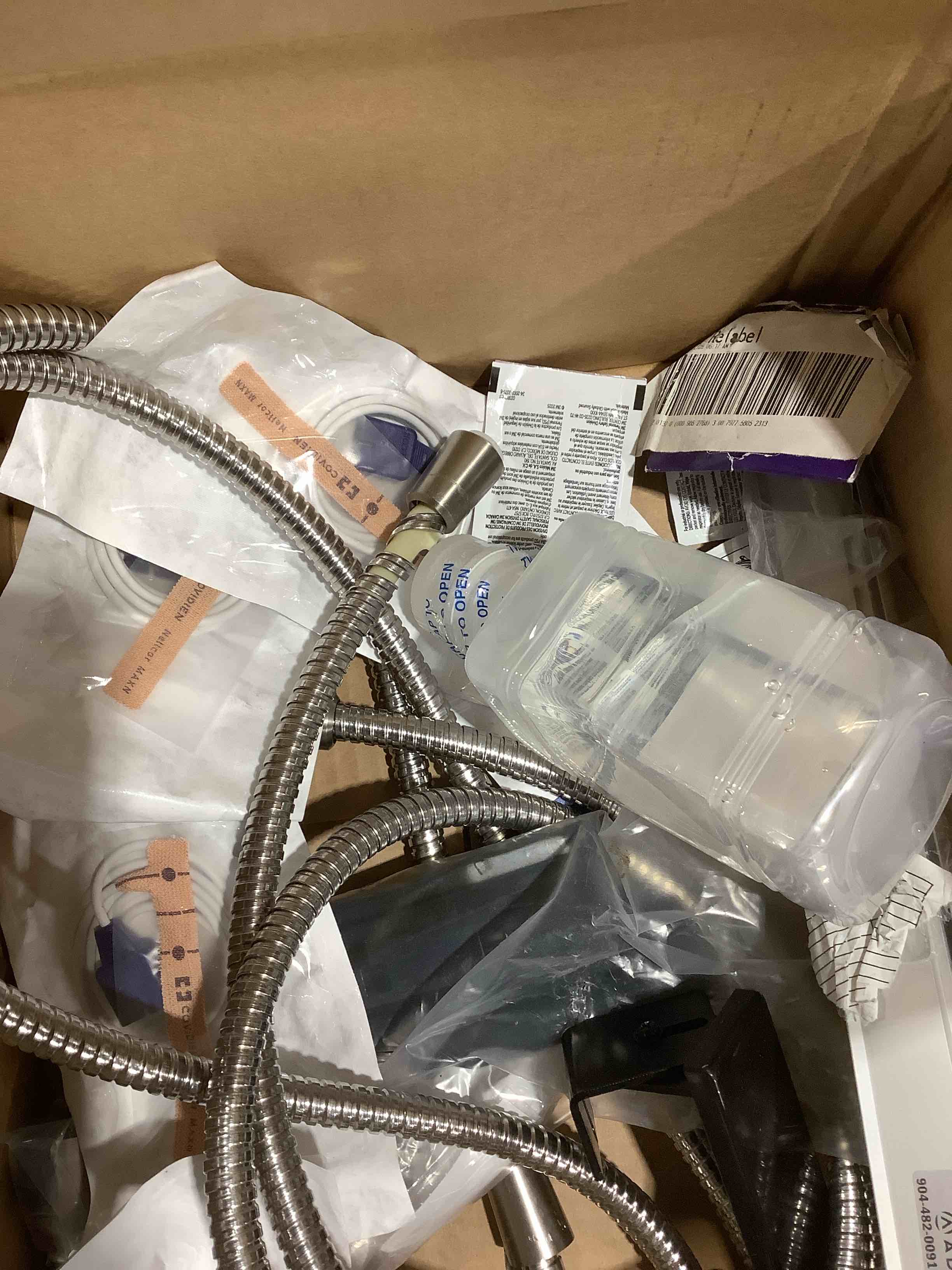 Condition photo showing As Is for Assortment of this, and that, Post-it note, showerhead, copy paper, and more