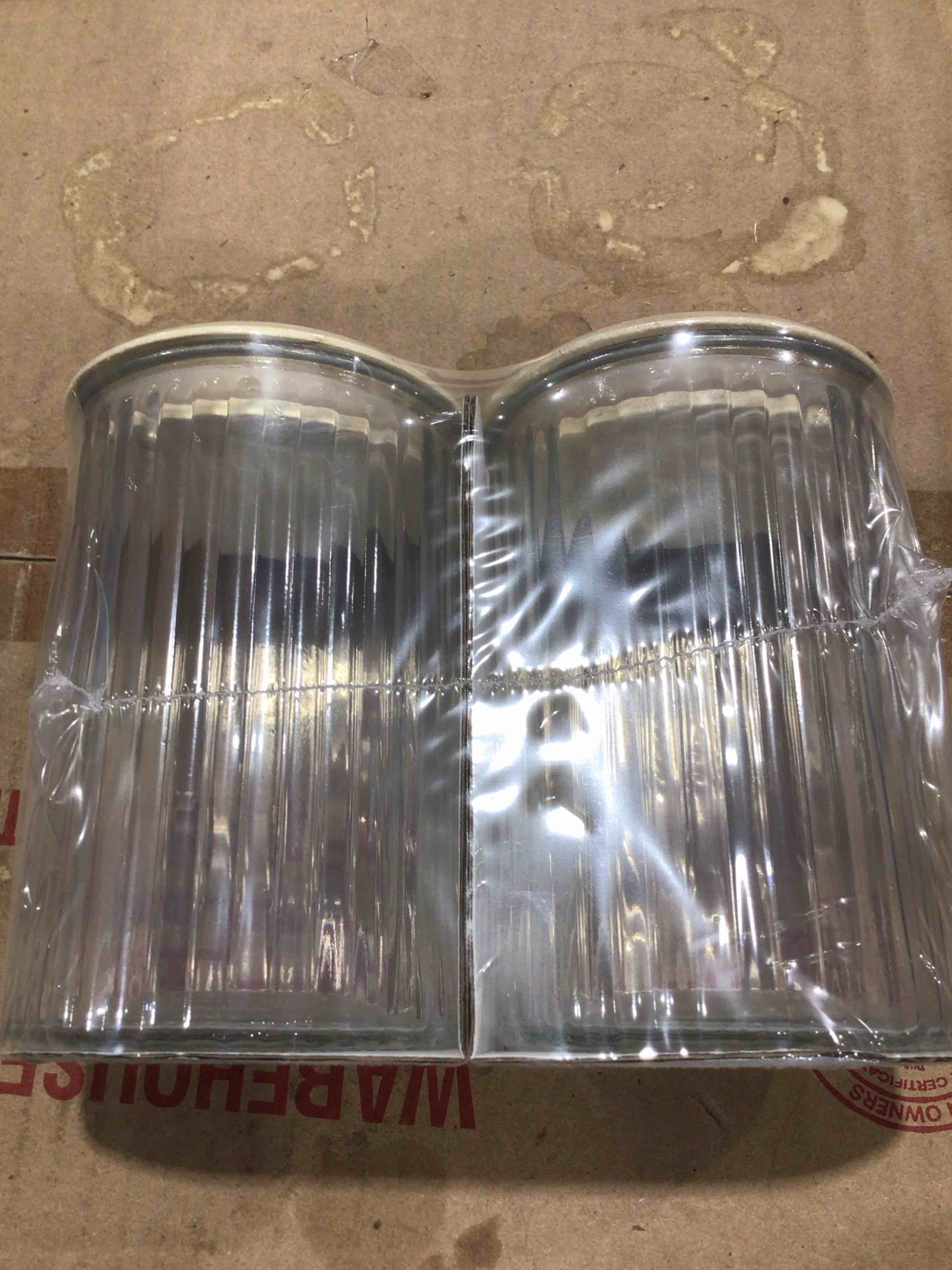 Two count glass jars, clear, decorative surface