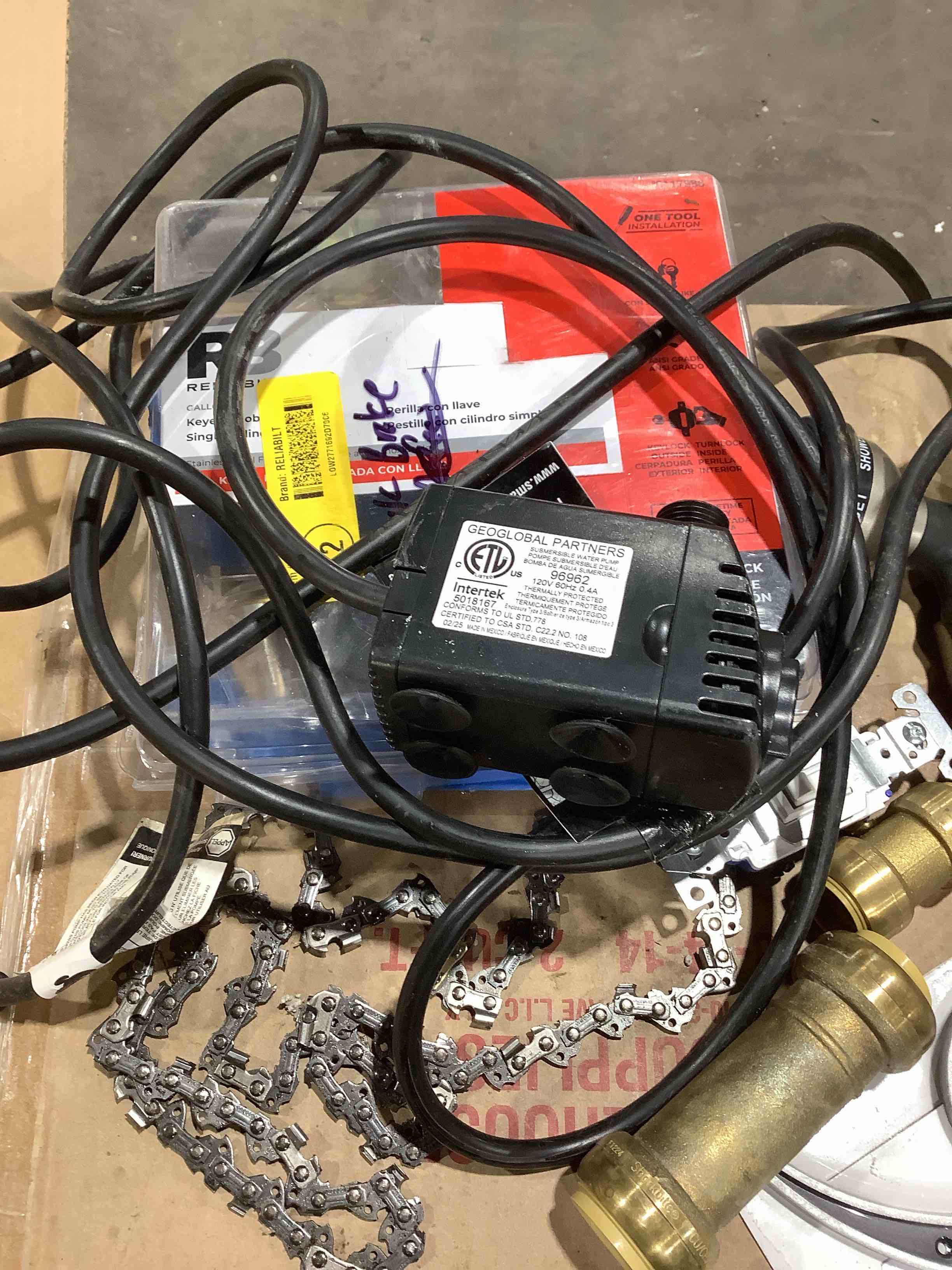 Condition photo showing Good Condition for Assorted this and that: sump pump, house number, outdoor solar light, light switch, chainsaw chain, and more
