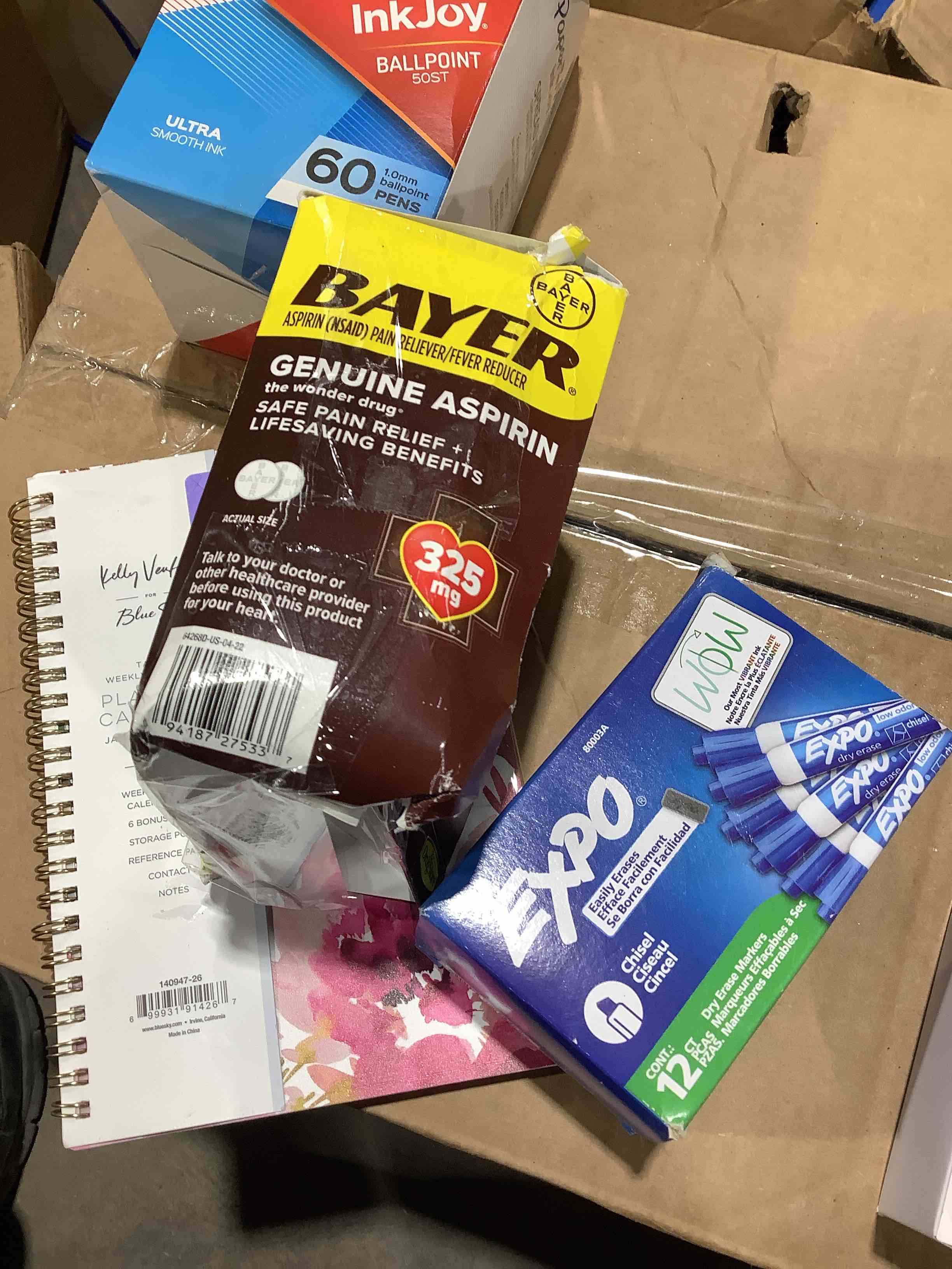 Assorted household and office supplies: Bayer genuine aspirin, 2026 planning calendar, exo Dry erase markers
