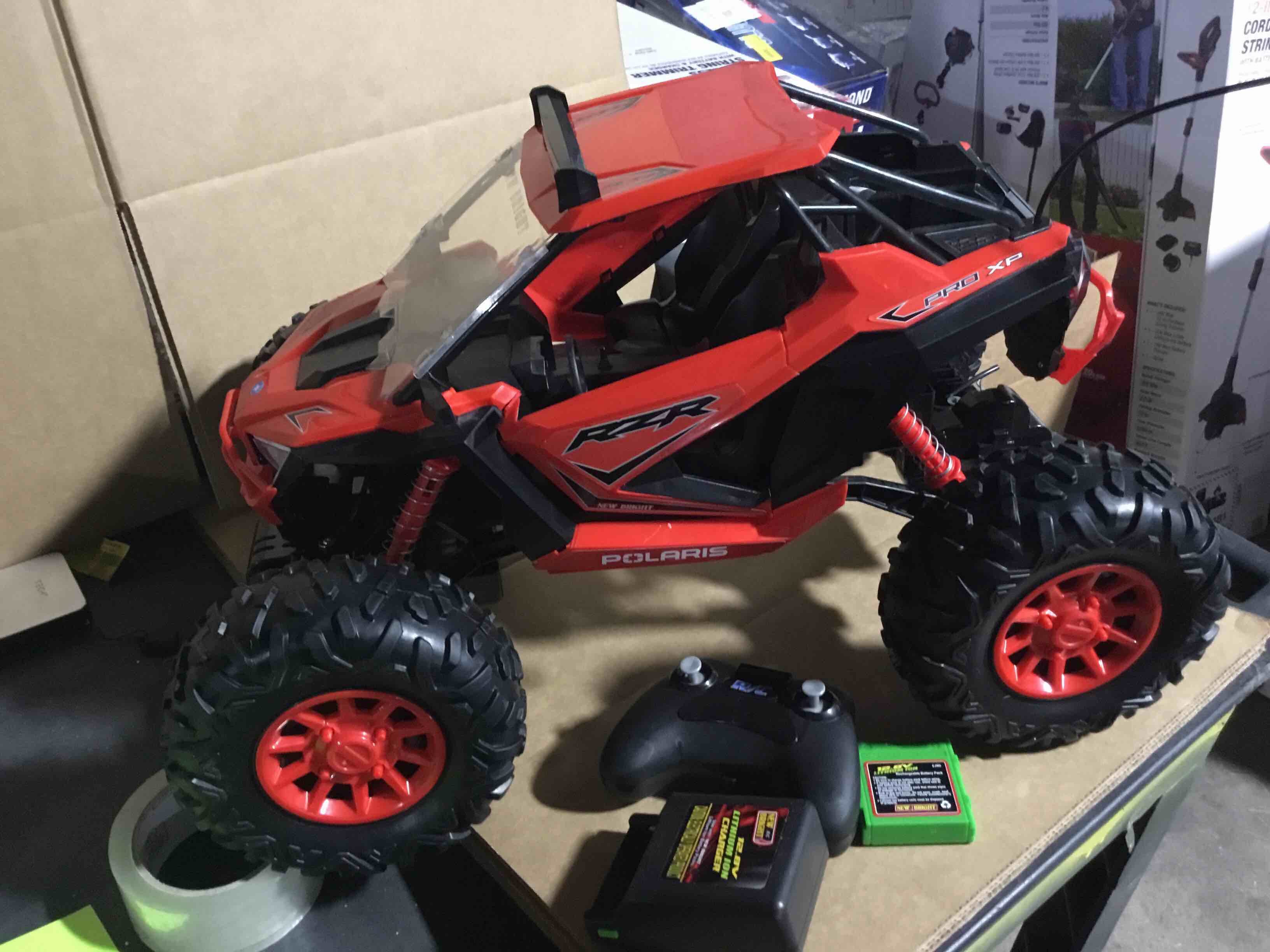Condition photo showing As Is for New Bright (1:5) RZR XP Pro Battery Remote Control Red Polaris ATV, 60805-2R Child Tween