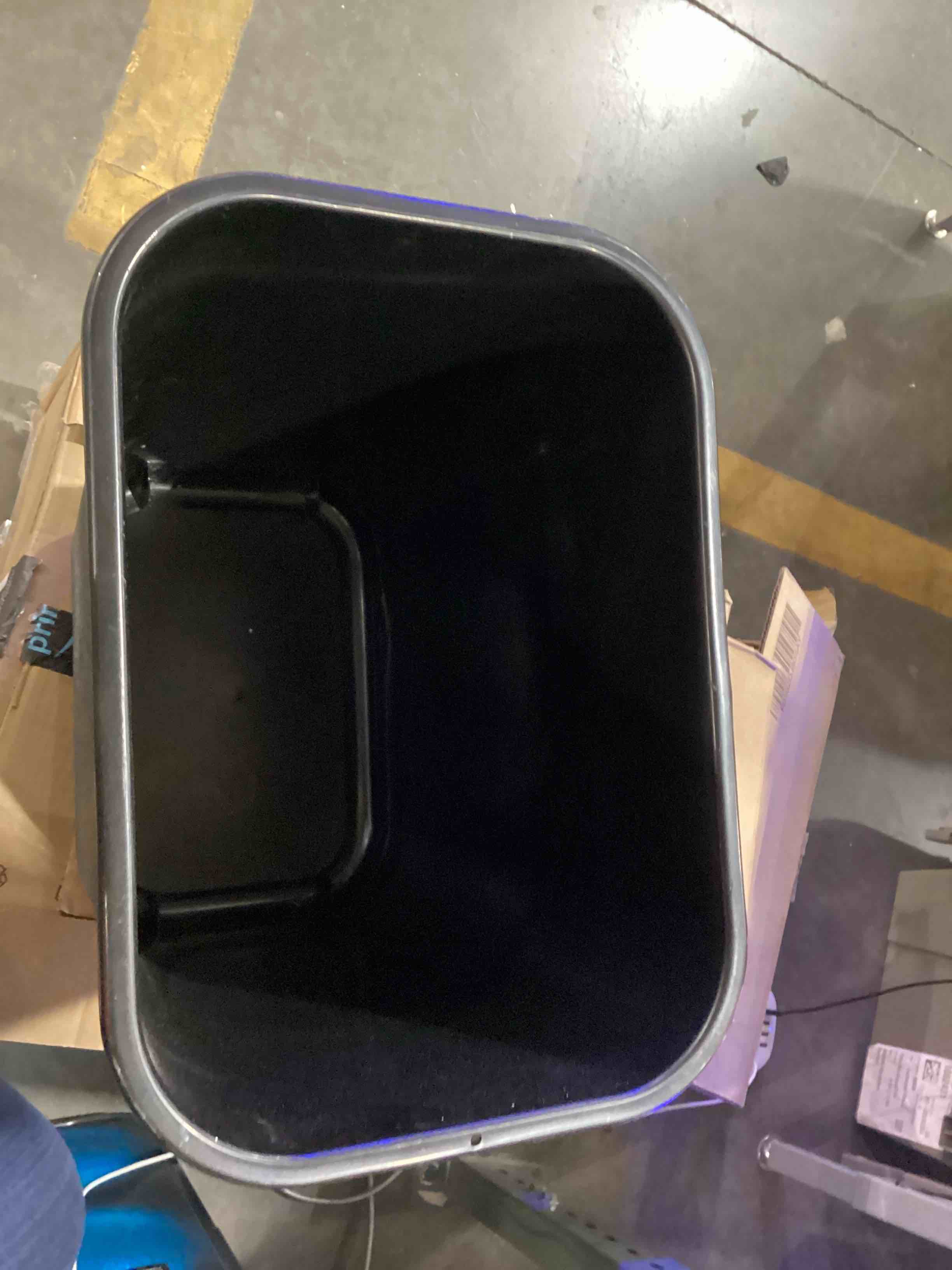 Condition photo showing As Is for small black trash can 