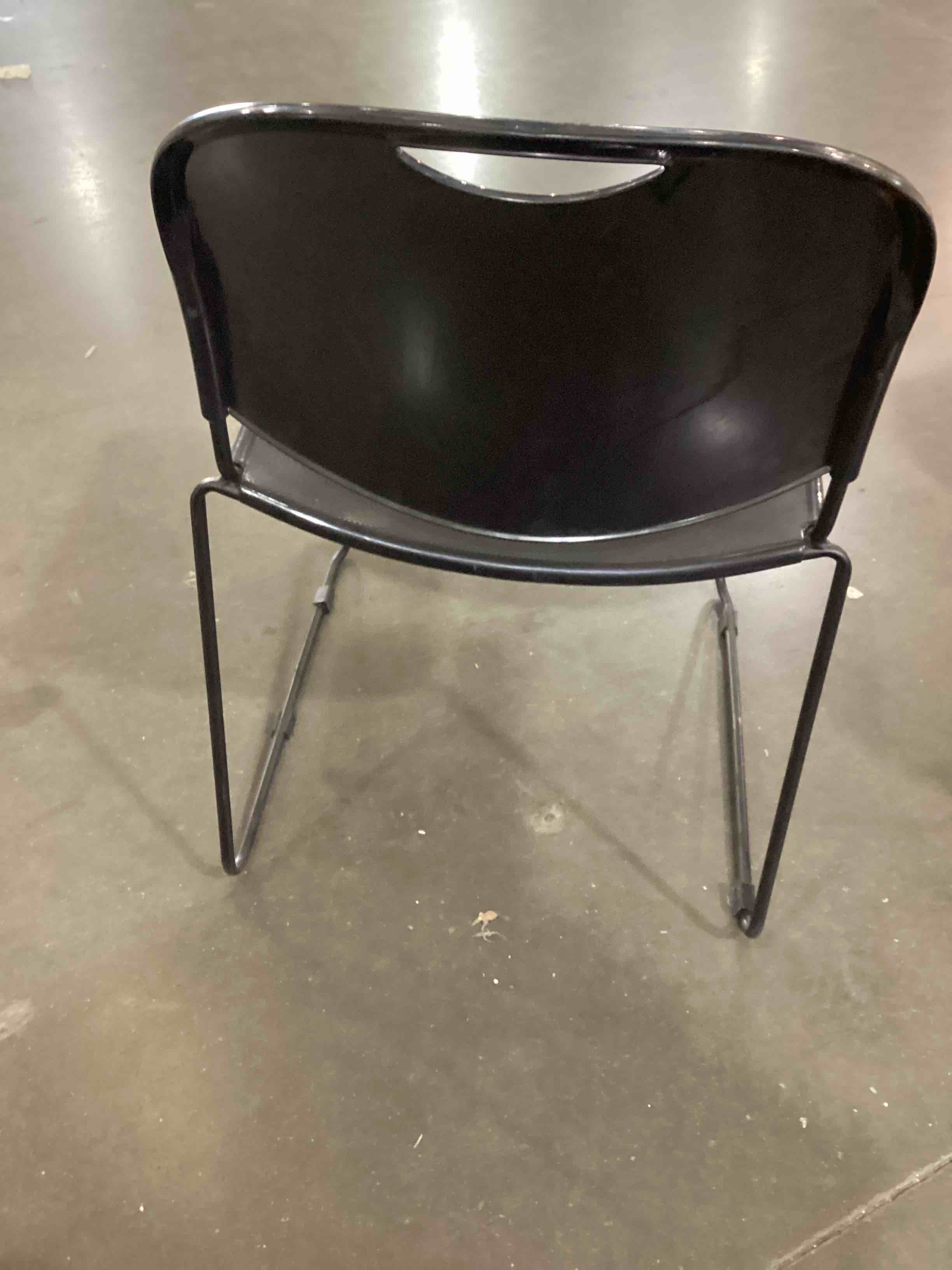 Condition photo showing Good Condition for this product appears to be a flash furniture hercules black stacking chair with a molded plastic seat