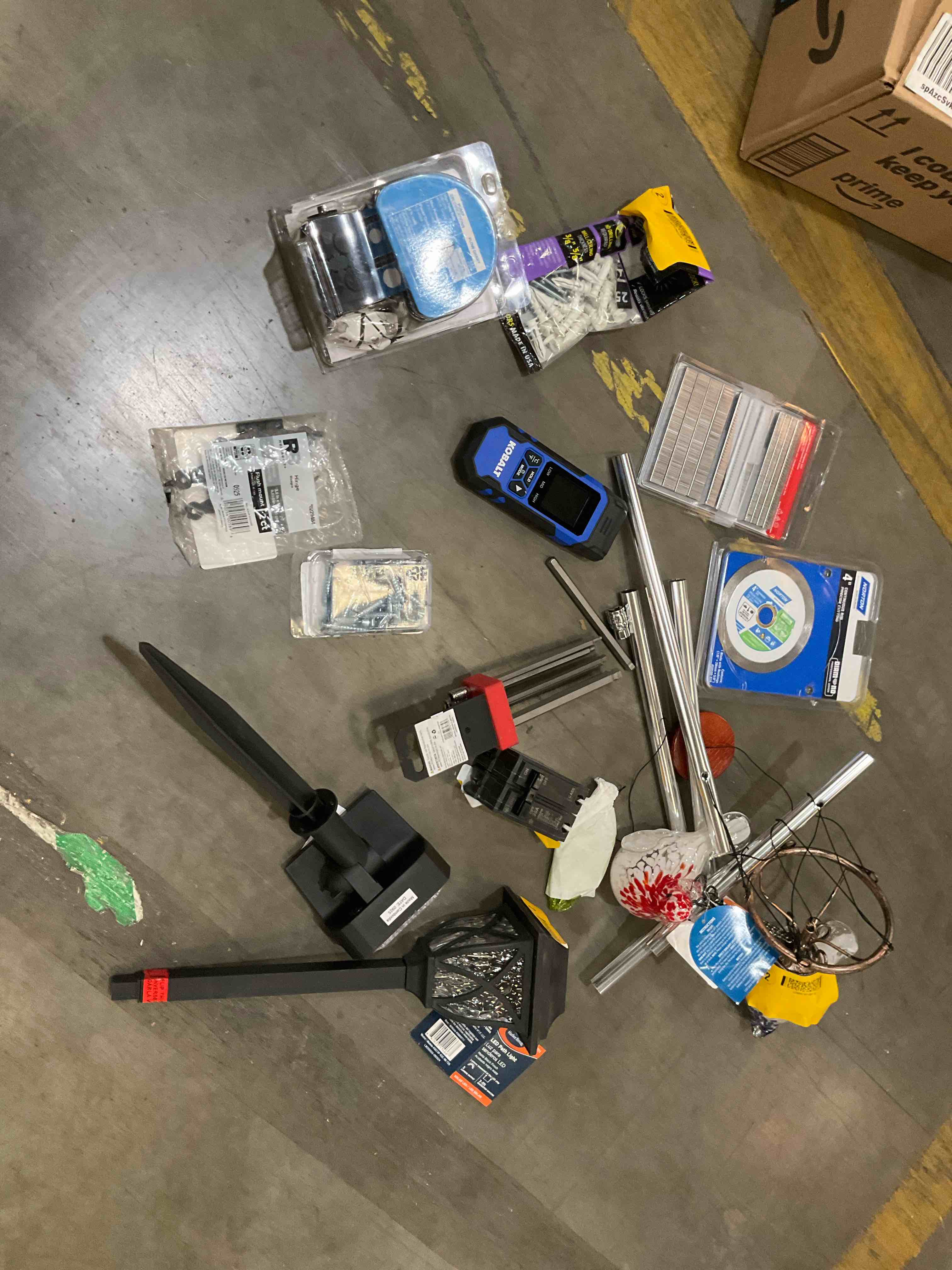Condition photo showing As Is for assorted home improvement lot (small tools, screw, home accessories, etc.)