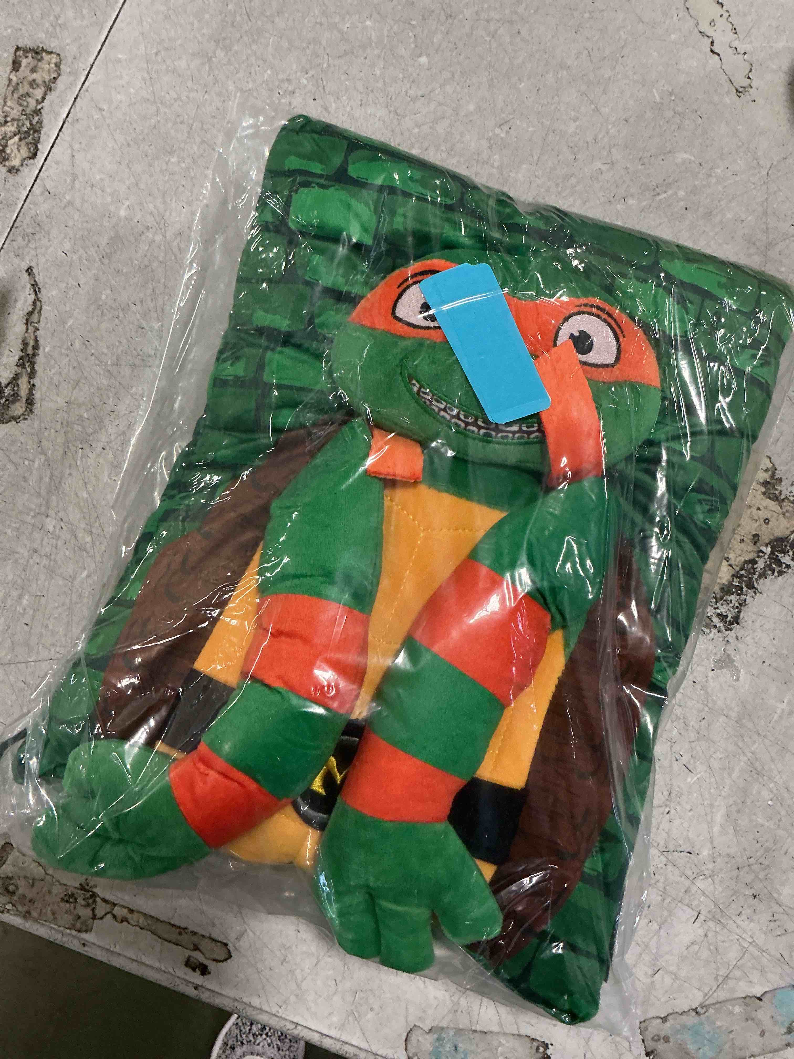 Condition photo showing item condition for Jay Franco Nickelodeon Teenage Mutant Ninja Turtles Michelangelo 3D Snuggle Pillow - Super Soft Green Plush Pillow - Measures 15 Inches Green - Michaelangelo