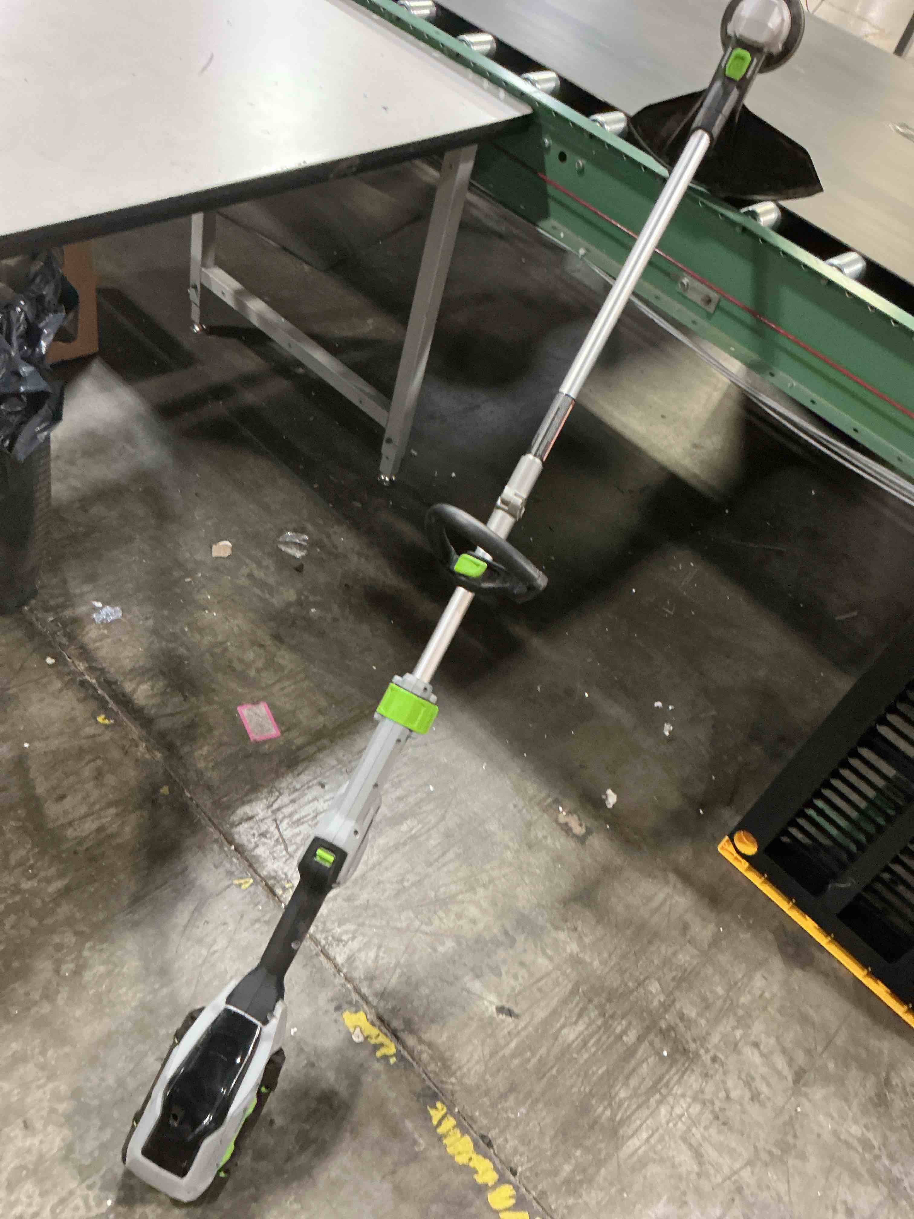 Condition photo showing As Is for ego st1511t 15-inch 56-volt lithium-ion cordless string trimmer kit alu foldable shaft battery and charger included, 15in powerload/telescopic/gauge(2.5ah), black