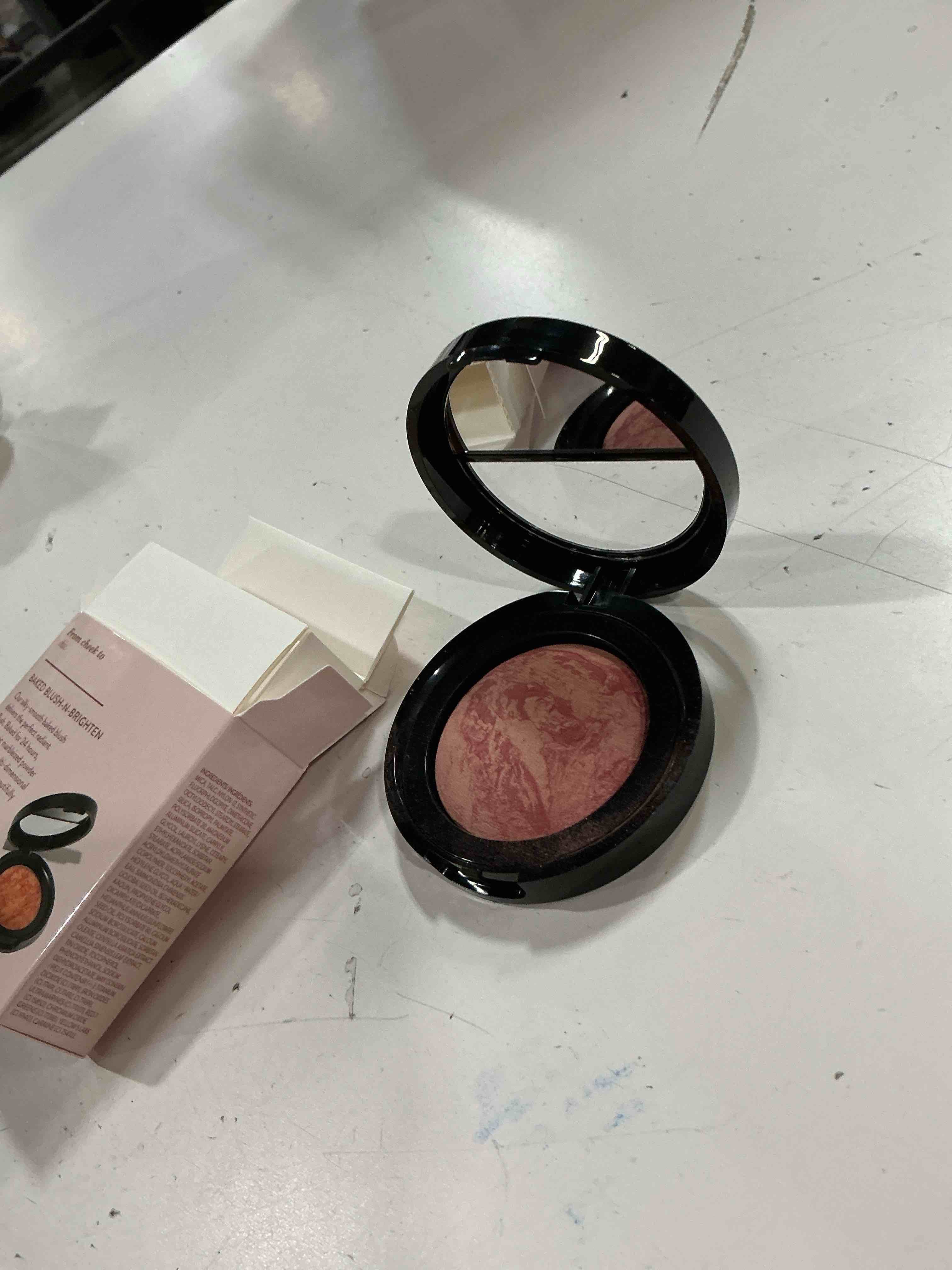 Condition photo showing New/Like New for laura geller new york baked blush-n-brighten marbleized blush for cheeks - tropical peach - natural finish - buildable color