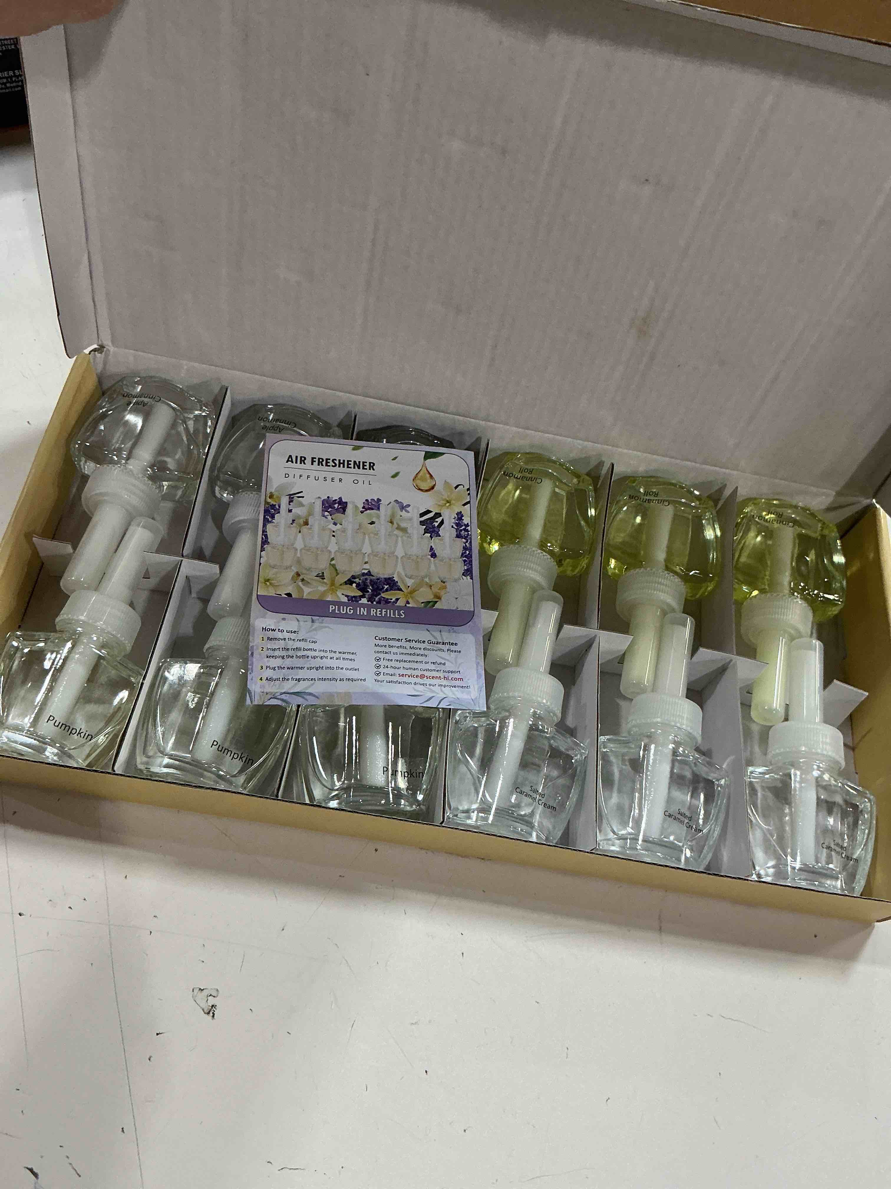 Condition photo showing New/Like New for 12 refills air freshener 