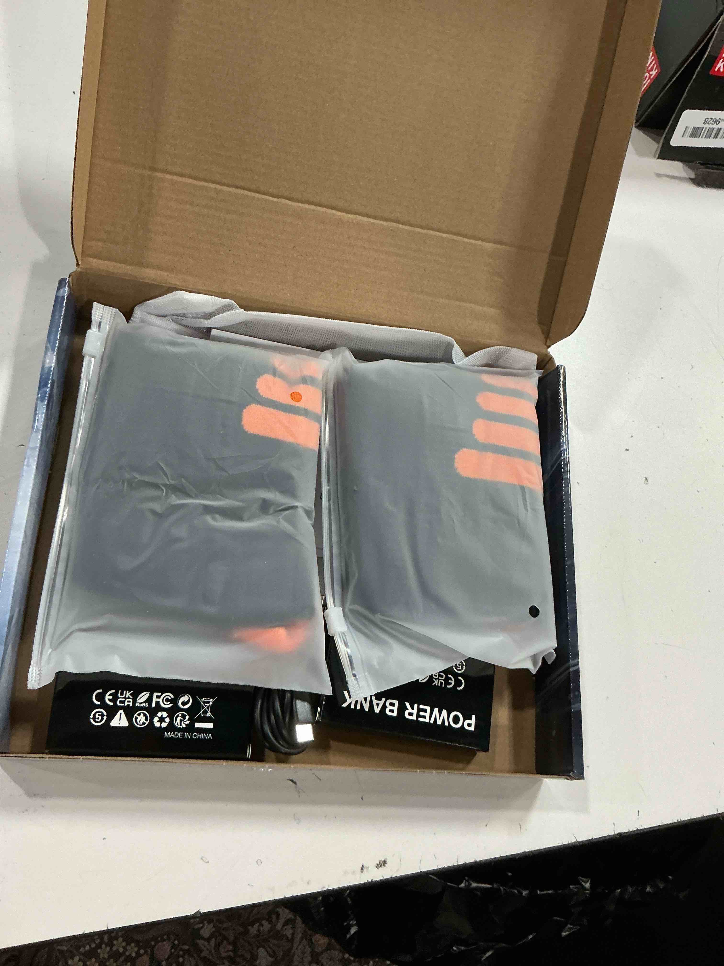 Condition photo showing New/Like New for heated socks