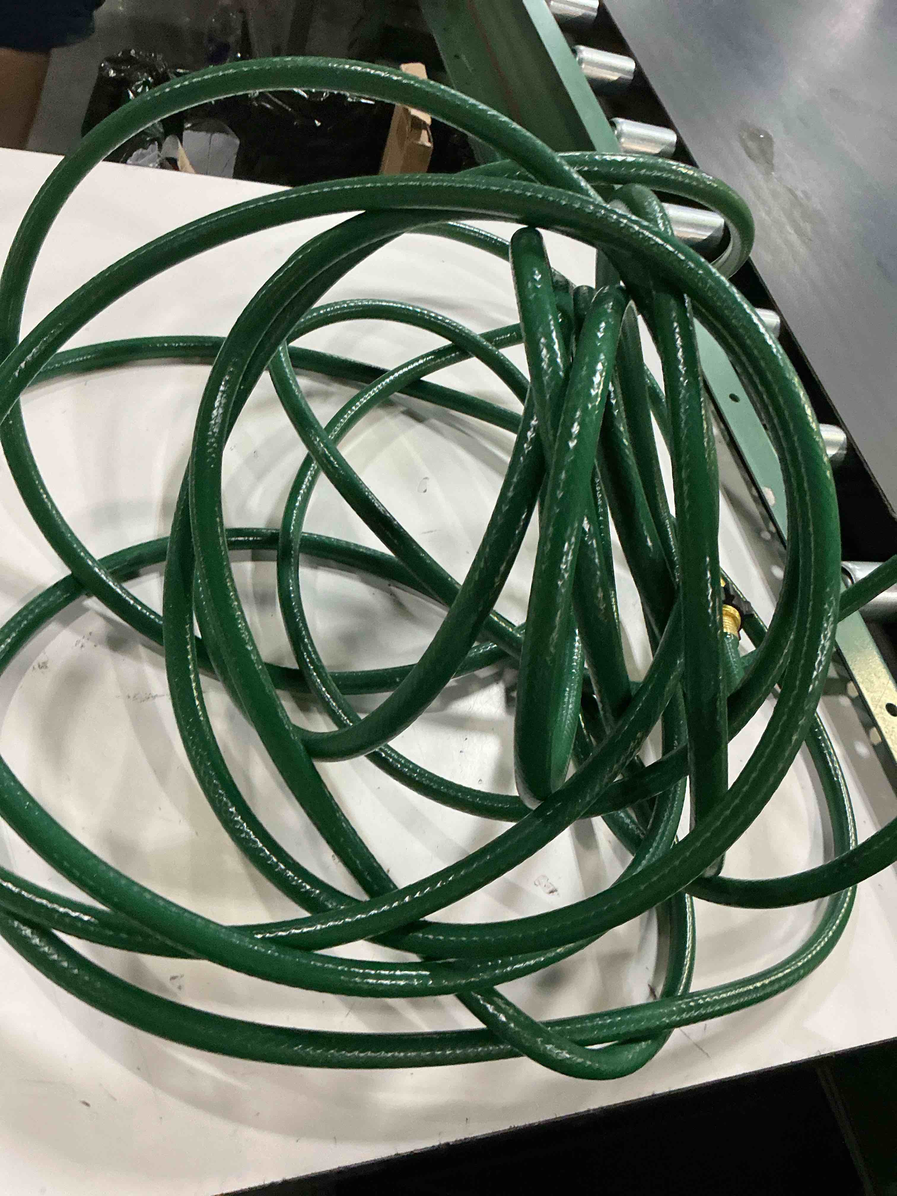 Condition photo showing As Is for project source 1/2-in x 50-ft light -duty vinyl green hose