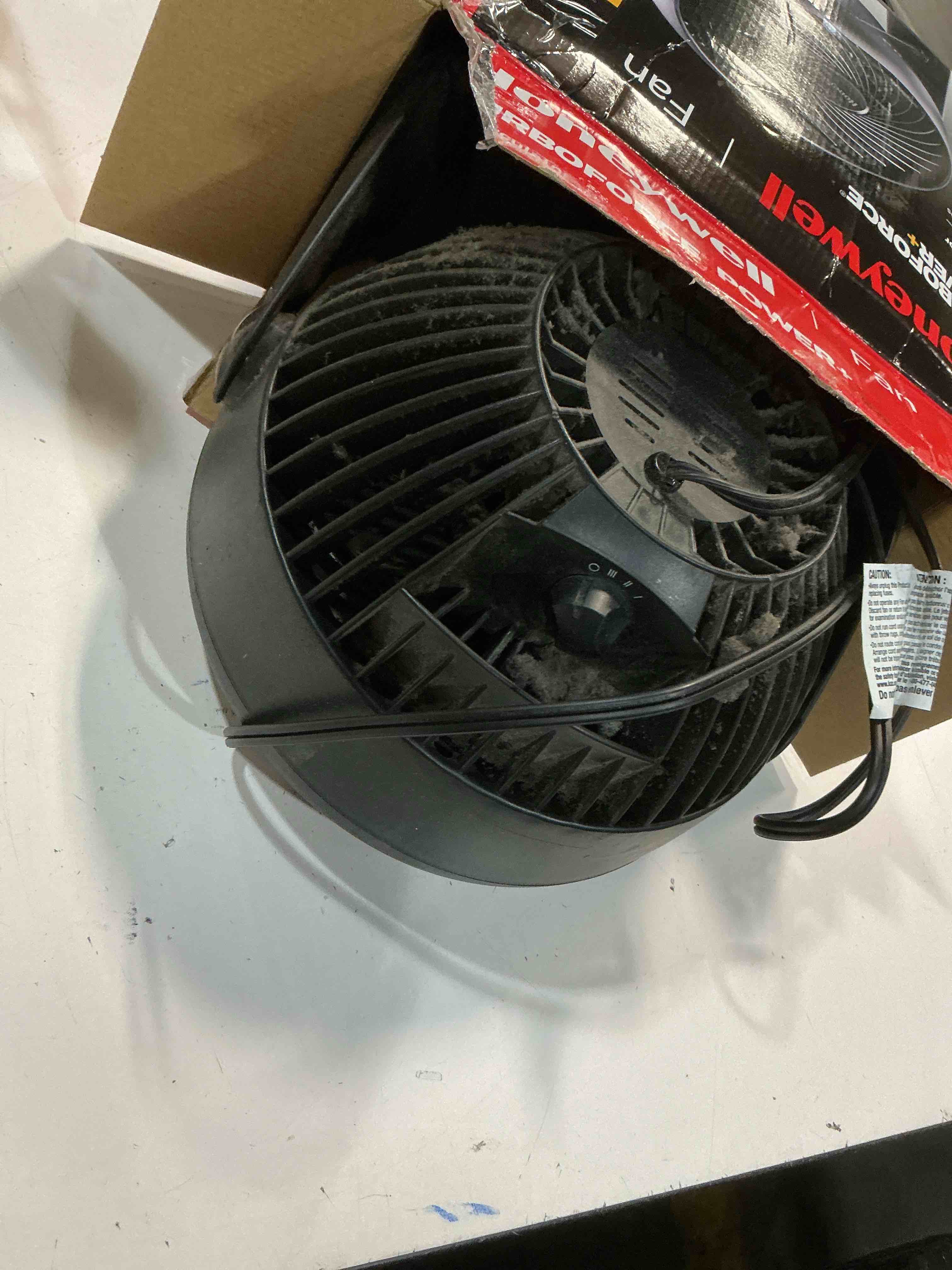 Condition photo showing As Is for honeywell black turbo force power table fan  new  6.3  l x 8.94  w x 10.9  h  hpf820bwm