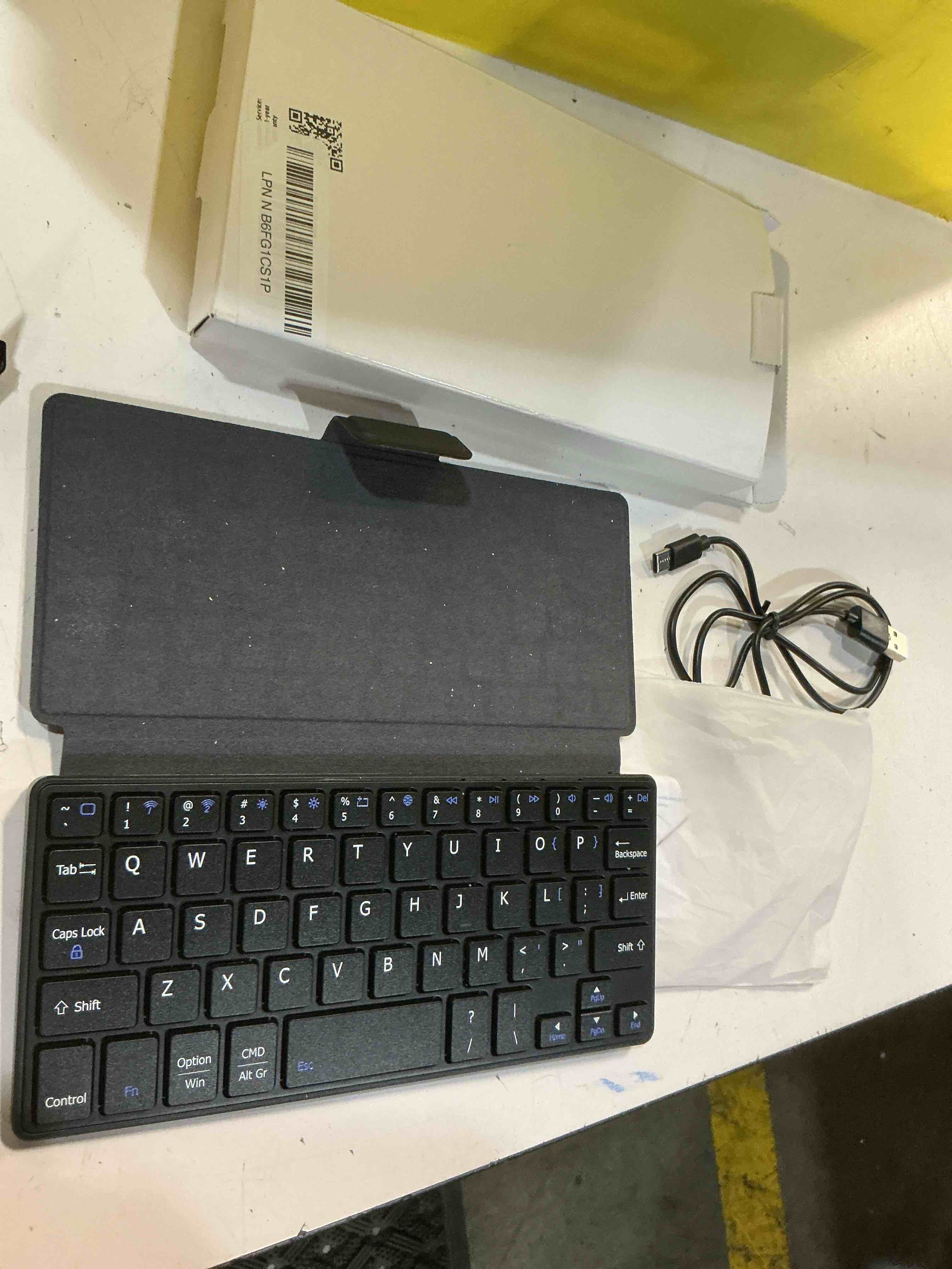 Condition photo showing As Is for universal wireless keyboards ultra light portable mini keyboard with adjustable angle stand & leather case,computer keyboards rechargeable travel bluetooth keyboard for ipad android,windows and ios black