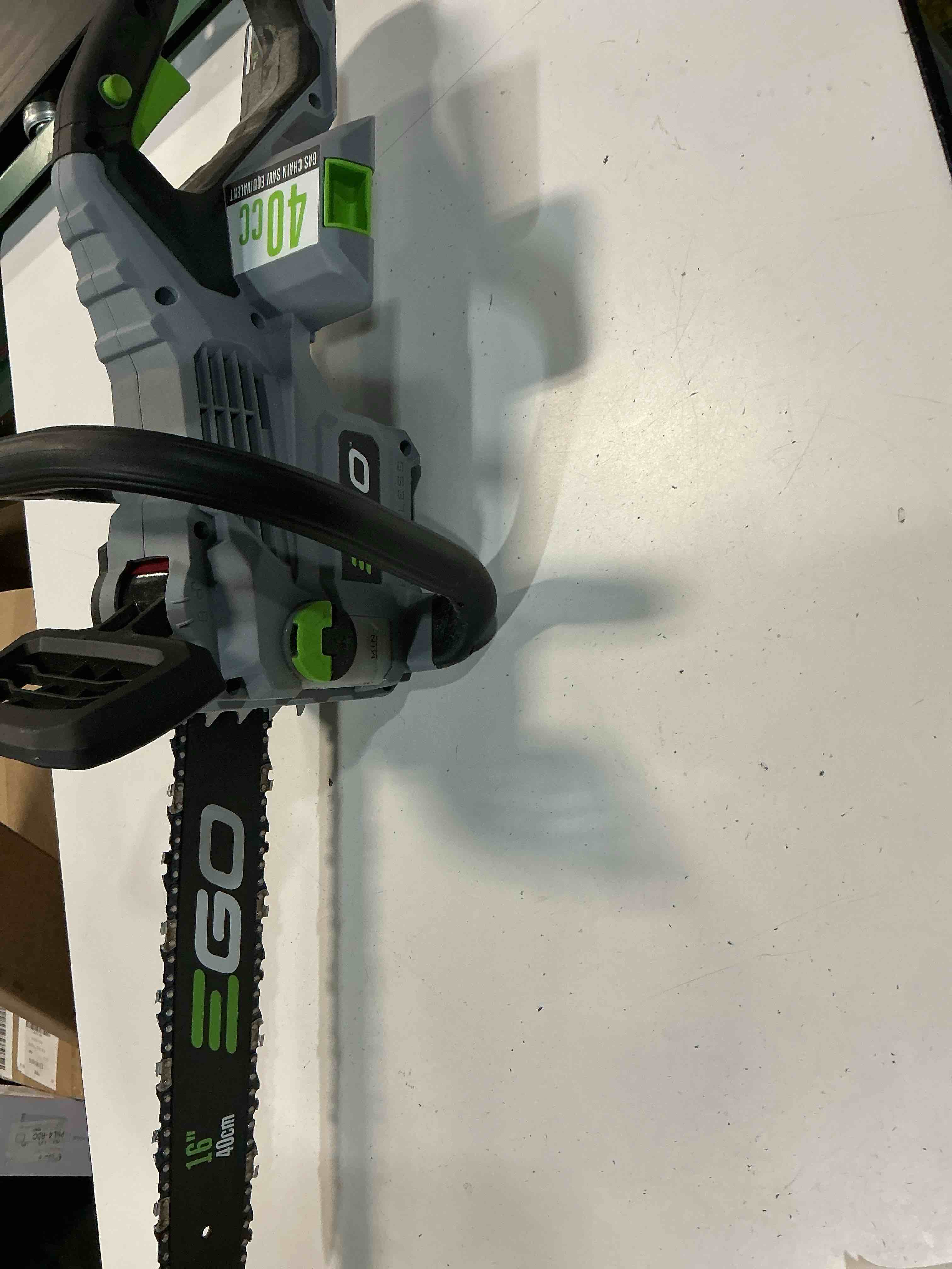 Condition photo showing As Is for ego power+ chain saw, 16” battery powered chainsaw, electric cordless, battery and charger not included – cs1610
