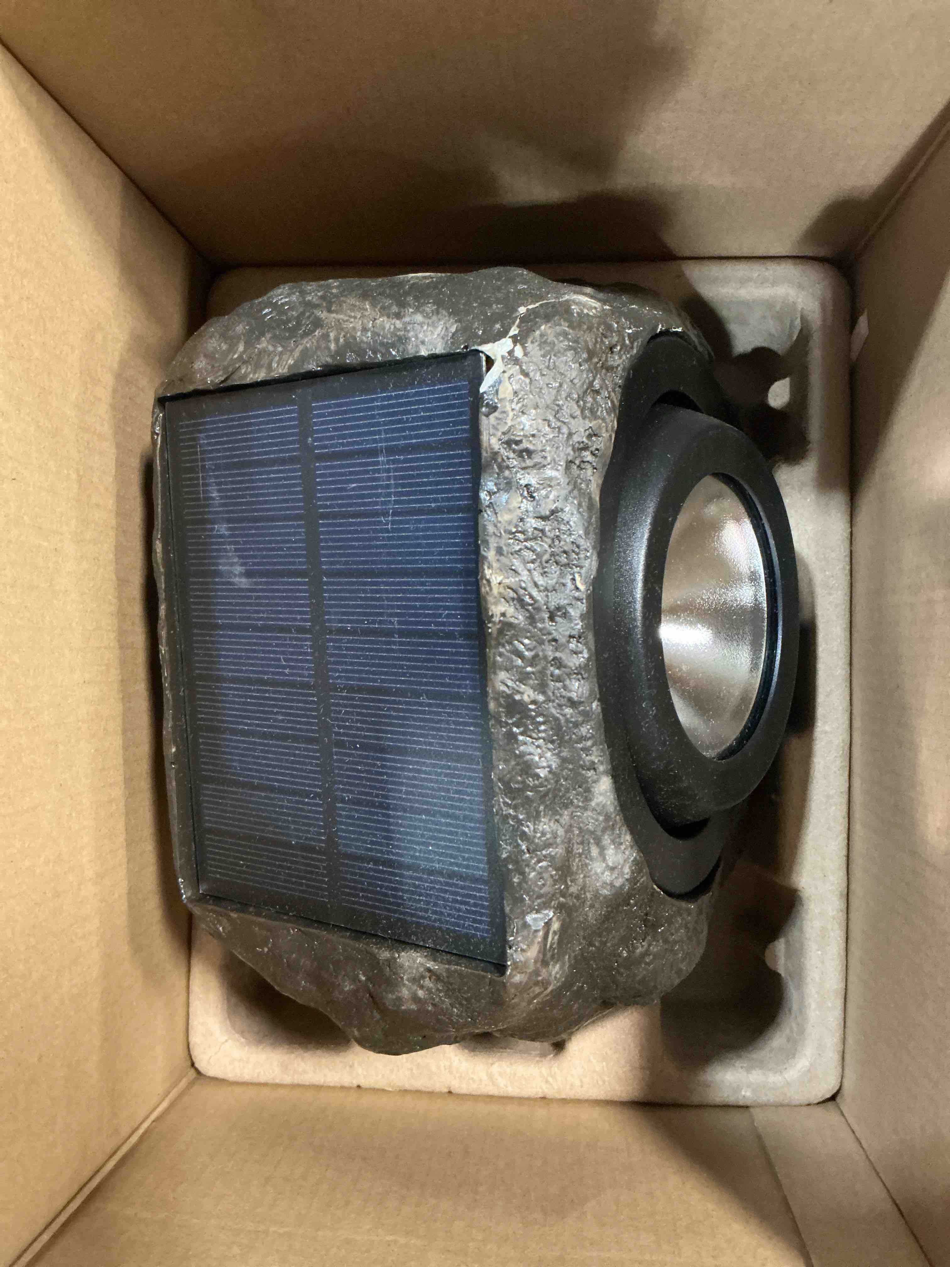 Condition photo showing As Is for harbor breeze rock flood light 40 -lumens 3.2 -watt grey warm white solar led flood light 