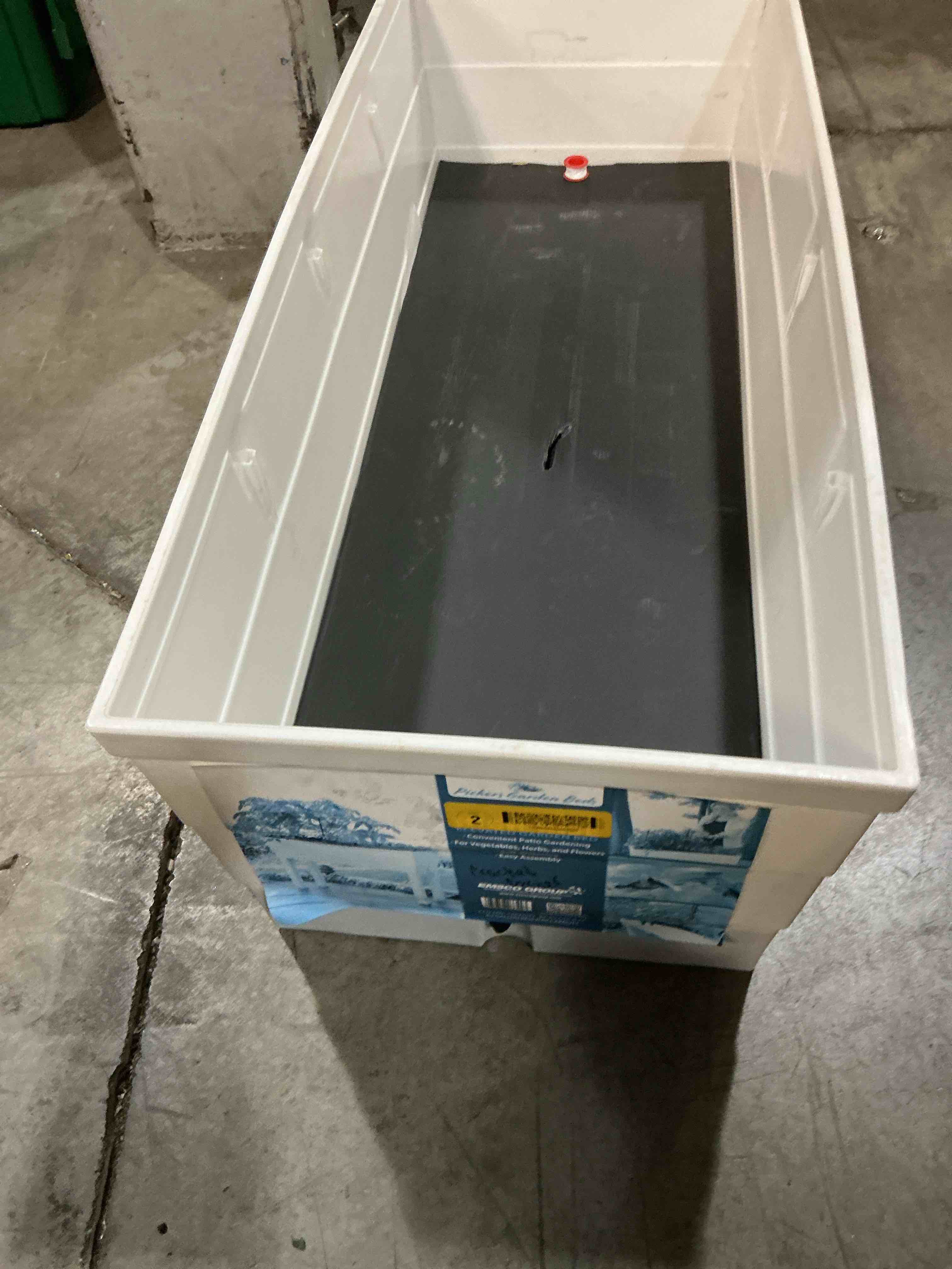 Condition photo showing As Is for emsco group 3-cu ft 13.25-in w x 33-in l x 28.75-in h elevated white resin raised garden bed