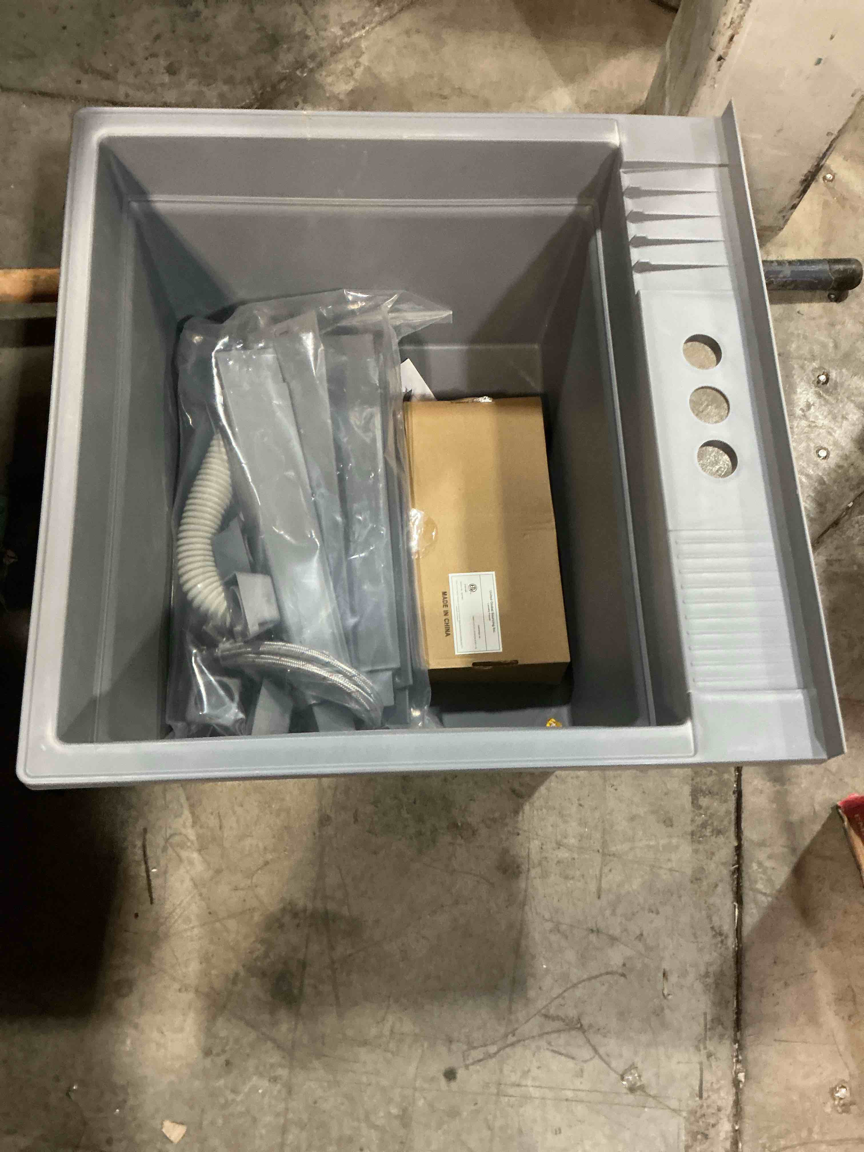 Condition photo showing As Is for project source 24-in x 24-in 1 -basin gray freestanding utility tub with drain with faucet (missing parts)