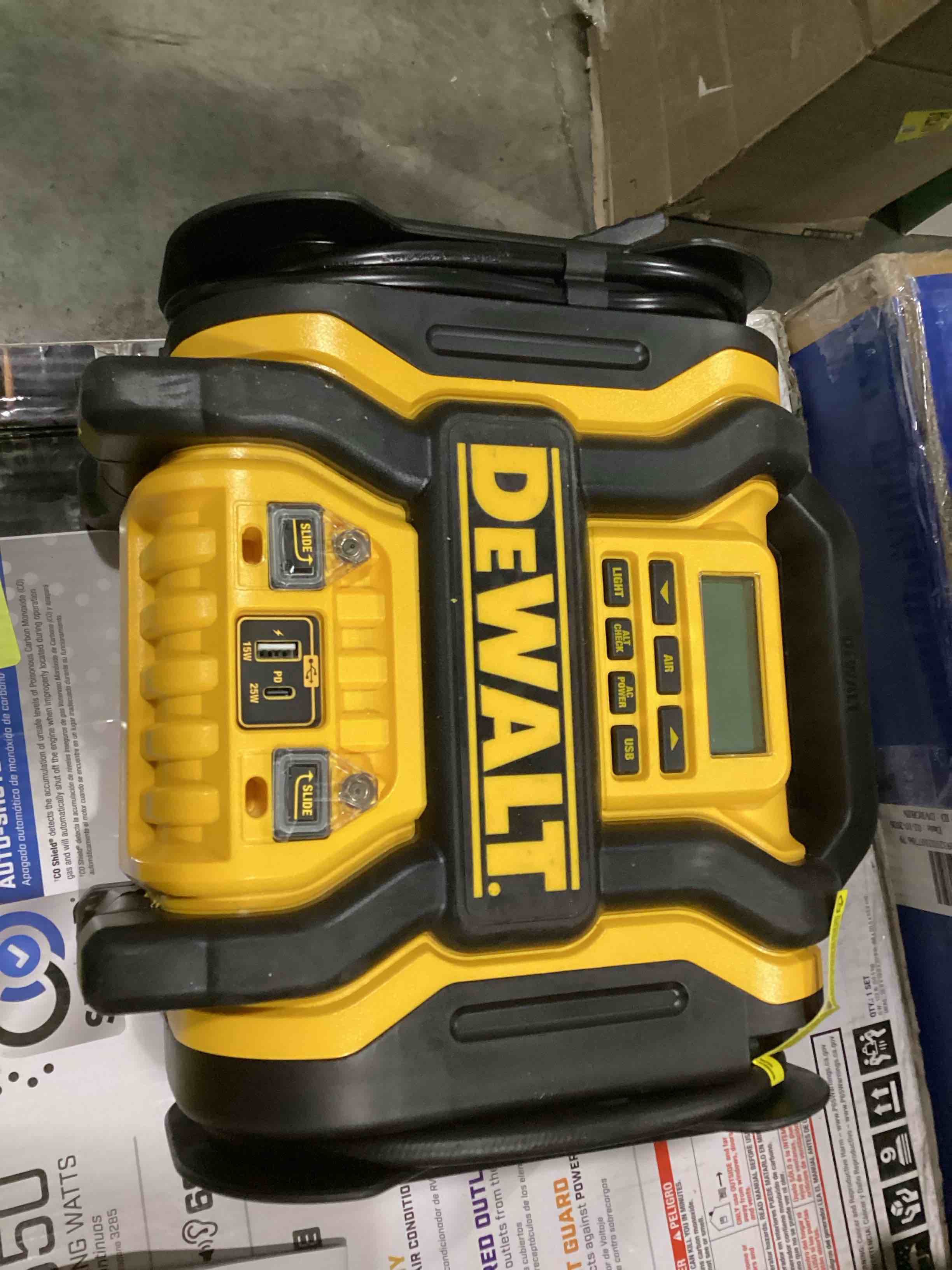 Condition photo showing As Is for dewalt dxaeps14 2000 peak battery amp 12v automotive battery booster jump starter/power station with 120 psi compressor, 500w ac power inverter, and 15w usba & 25w usb ports (missing charger)