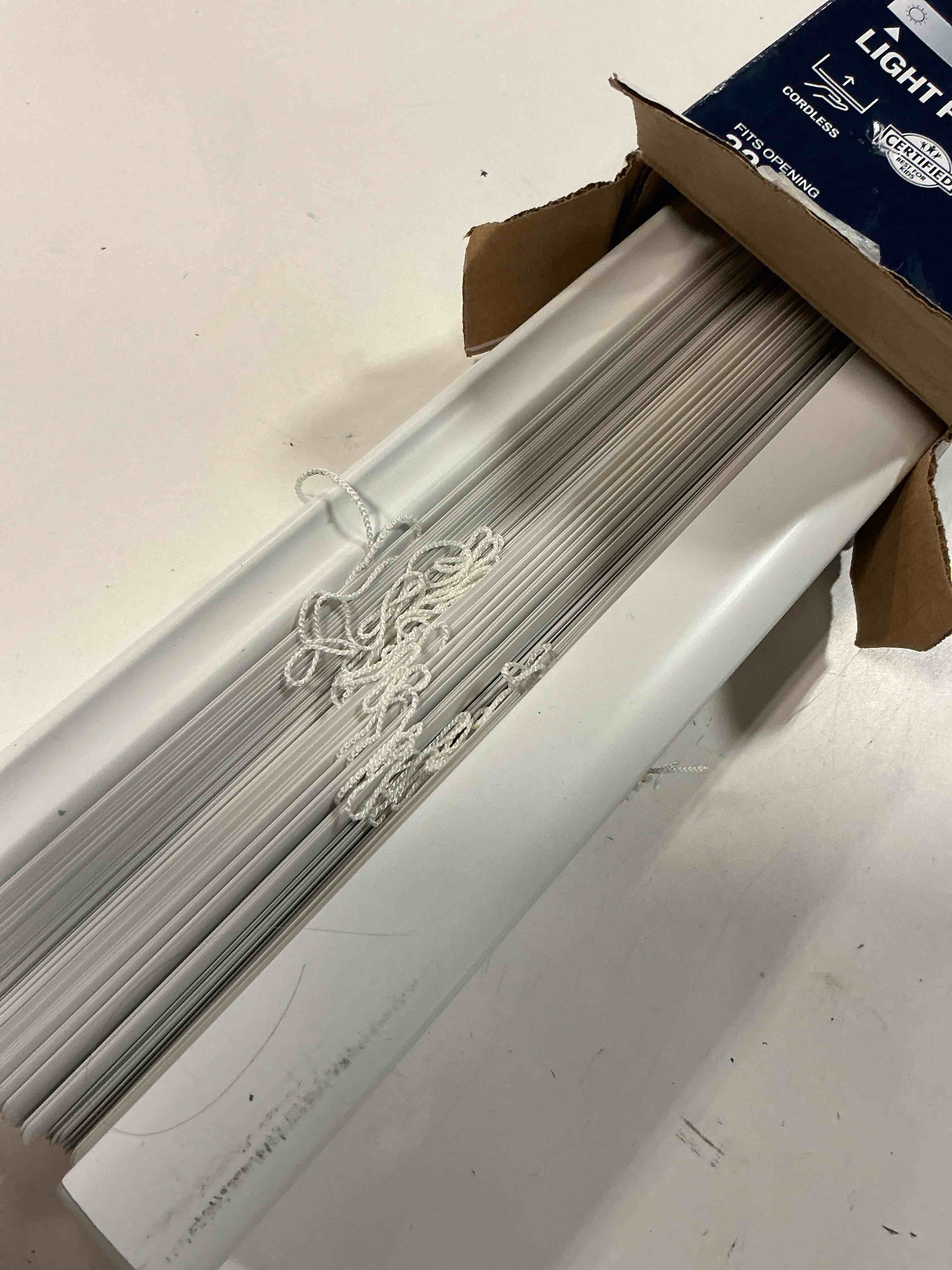 Condition photo showing As Is for project source light filtering 1-in slat width 35-in x 64-in cordless white vinyl light filtering mini-