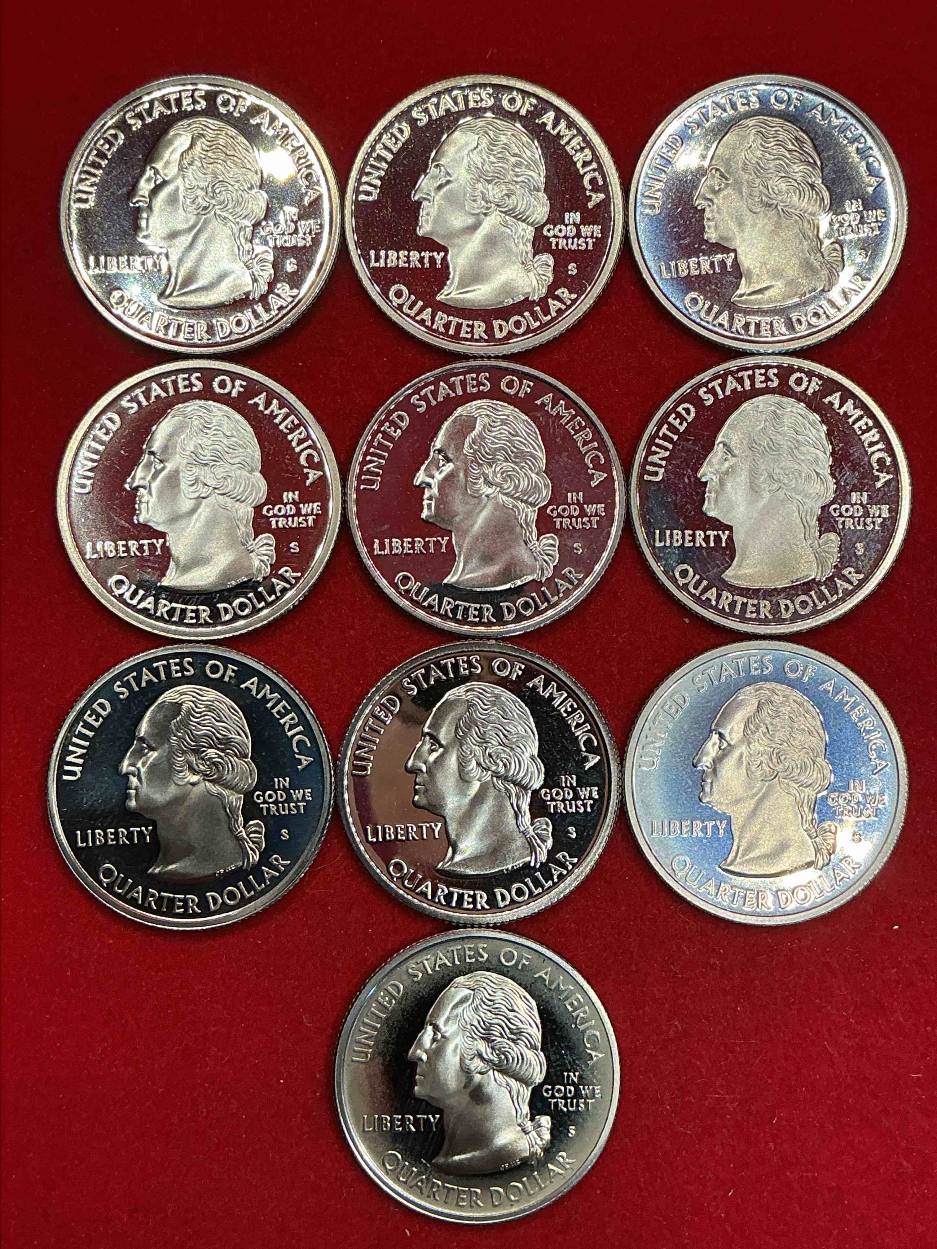 Condition photo showing New/Like New for proof quarters, year 2000!  a great collection of various proof state quarters from year 2000, uncirculated proof condition!  these quarters are gorgeous & a serious collector items!  