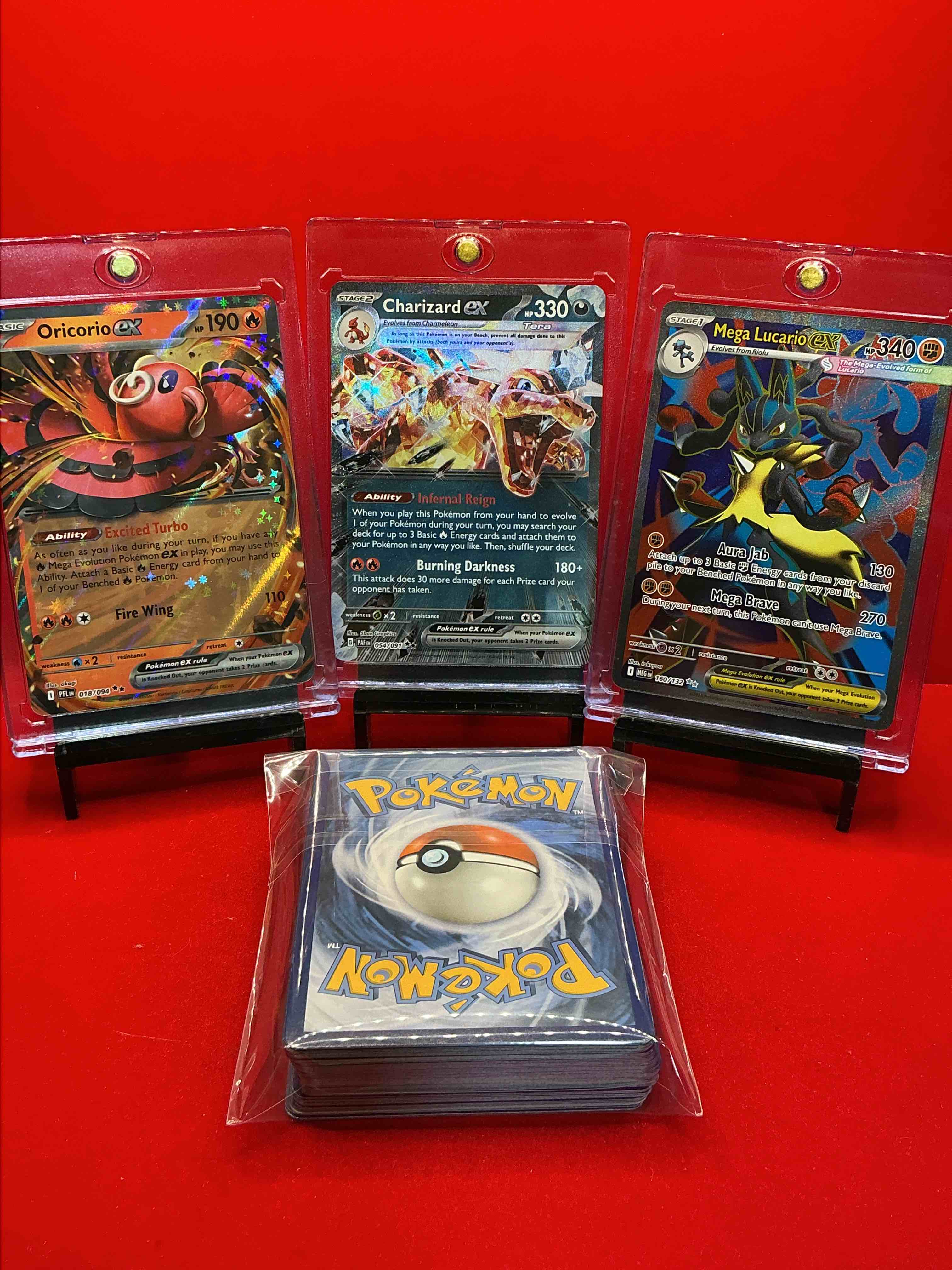 Condition photo showing New/Like New for pokémon pack! charizard ex! oricorio ex! mega lucario ex! along with 50 other pokémon heroes, holos, legends & commons- including holographic cards, stage 2 card, holos in many forms & more! also includes non holo common/ uncommon basic & first stage cards & maybe even trainers & energy too! perfect set for collectors & enthusiasts!