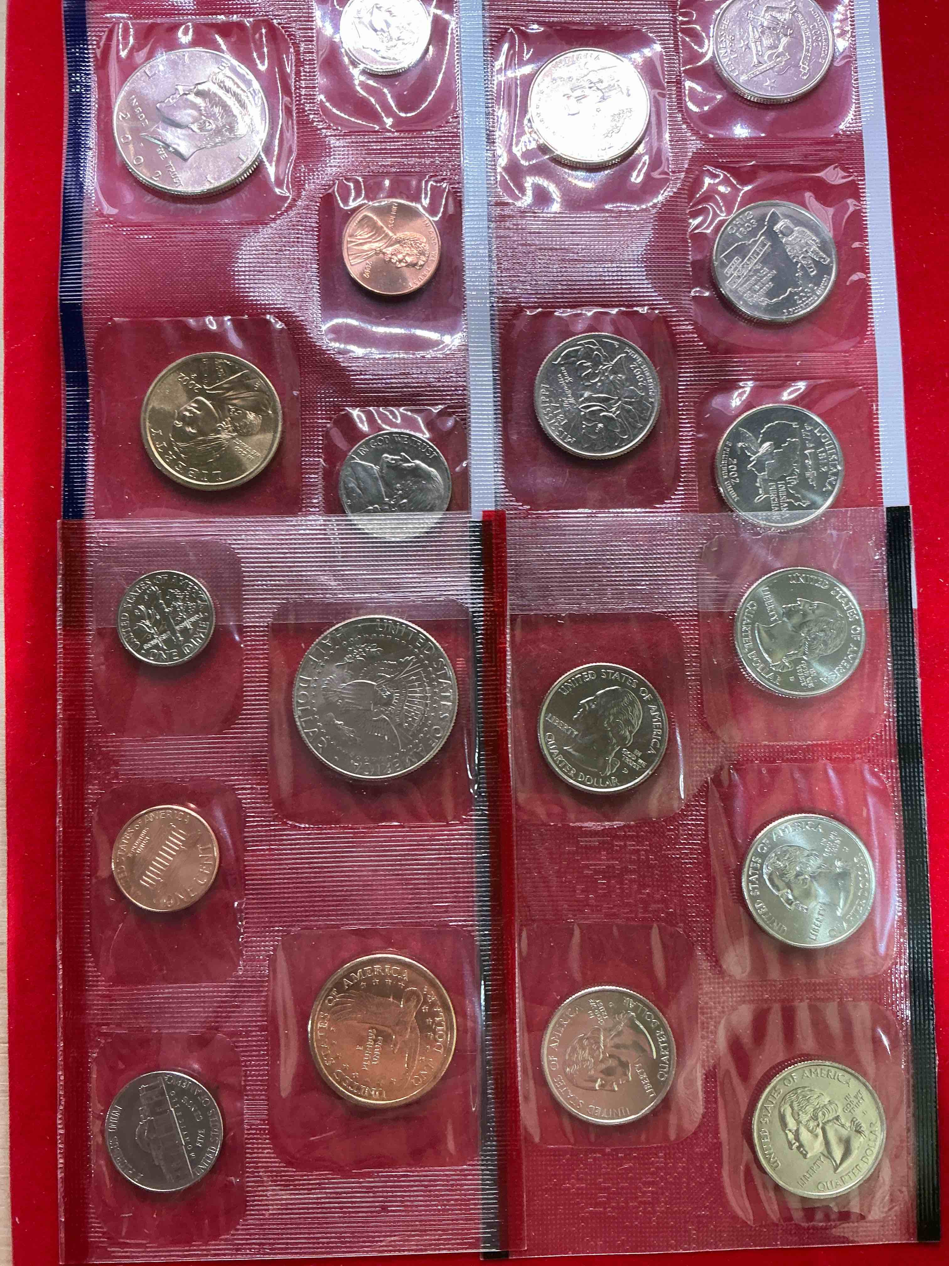 Condition photo showing New/Like New for 2002 uncirculated mint coins! 20 coins from philadelphia & denver! 20 coin uncirculated lot, with state quarters, nickels, half dollars, dimes, pennies & more! uncirculated coin craziness!