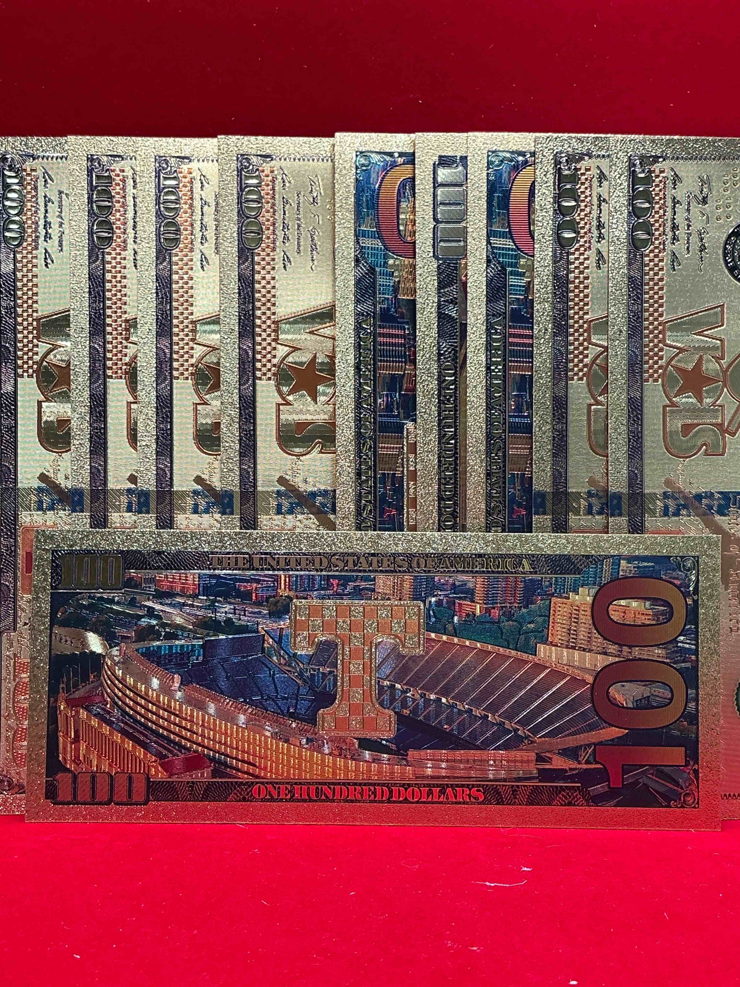 Condition photo showing New/Like New for tennessee volunteers collectible memorabilia! super cool, gold in color 100 dollar commemorative vols university bill! cool designs on front & back of bill! ut fans rejoice, cool memorabilia! plastic bills with cool designs! 