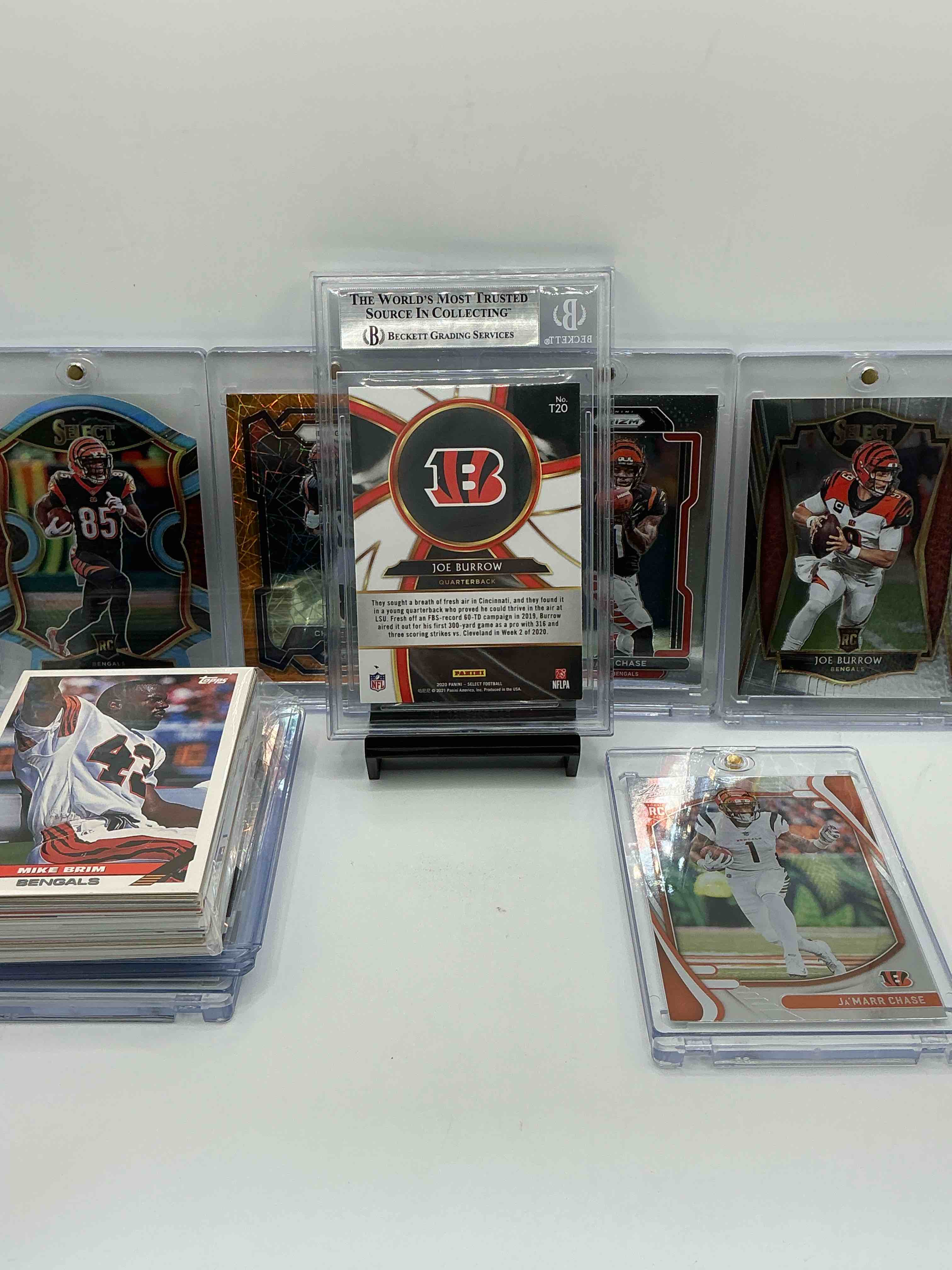 Condition photo showing New/Like New for bengals rookies insanity! joe burrow graded rookie! tee higgins, chase brown & ja’marr chase select & prizm rookies! tons modern & vintage bengals in this 50 card lot! rookies, heroes, legends & commons! bengals fans, you cannot miss this one!