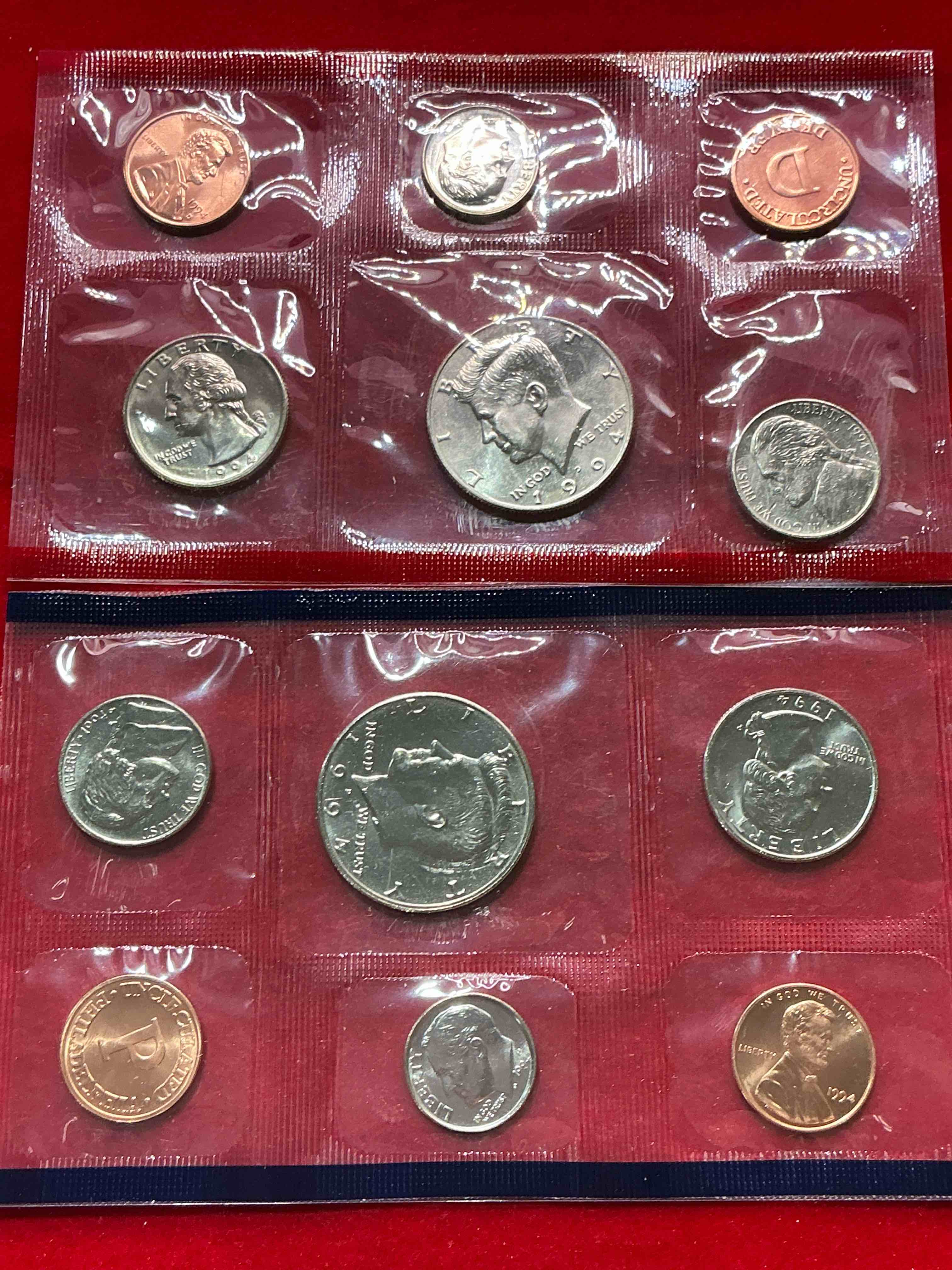 Condition photo showing New/Like New for 1994 uncirculated mint coins! 12 coin mint from philadelphia & denver! 12 coin uncirculated lot, with quarters, nickels, half dollars, dimes, pennies & more! uncirculated coin craziness!
