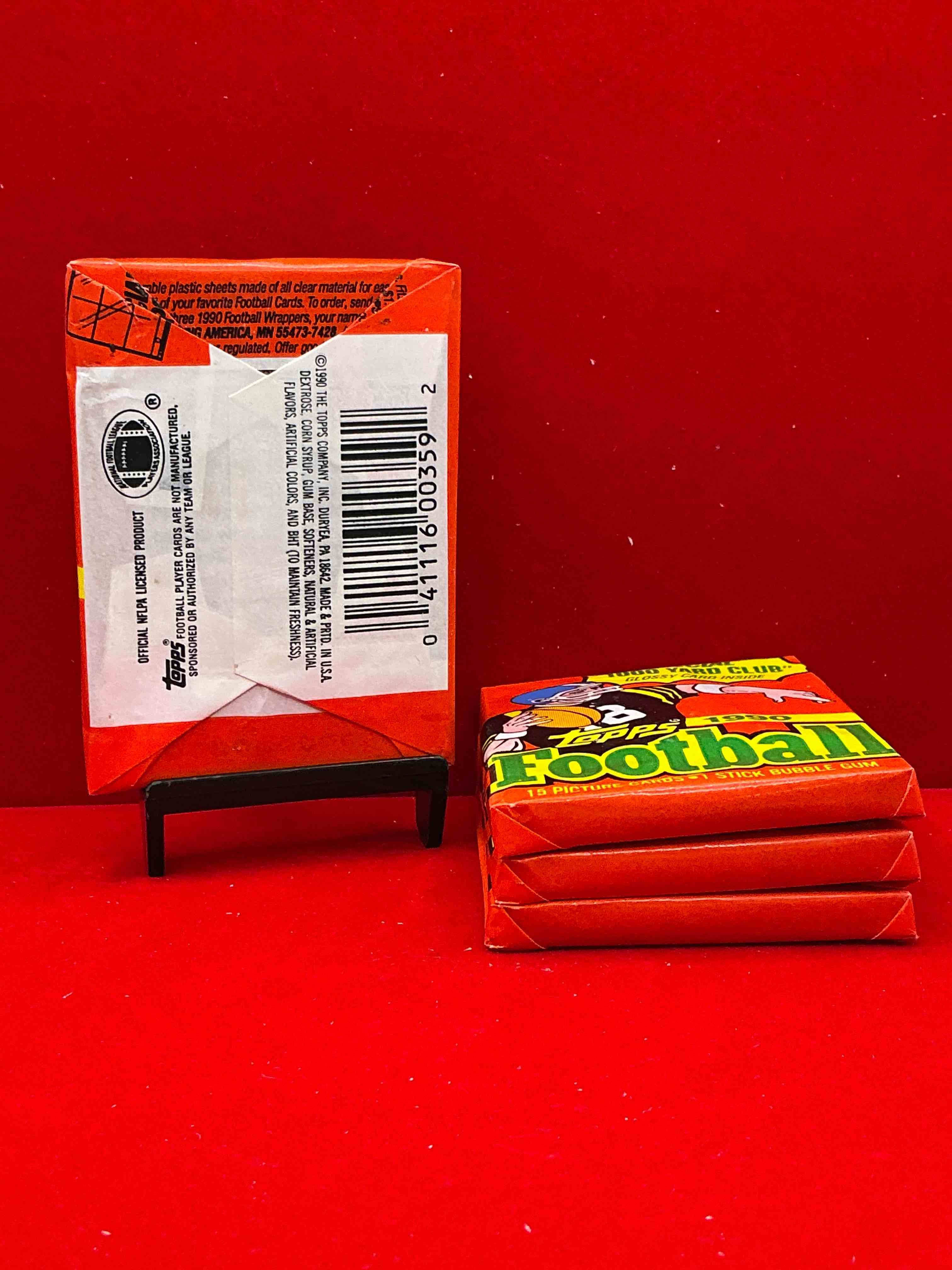 Condition photo showing New/Like New for the last year of football wax! joe montana, emmitt smith & barry sanders!? 1990 topps football unopened sports card wax pack, direct from original retail box! getting hard to find! search for early barry sanders & jerry rice & so much more!