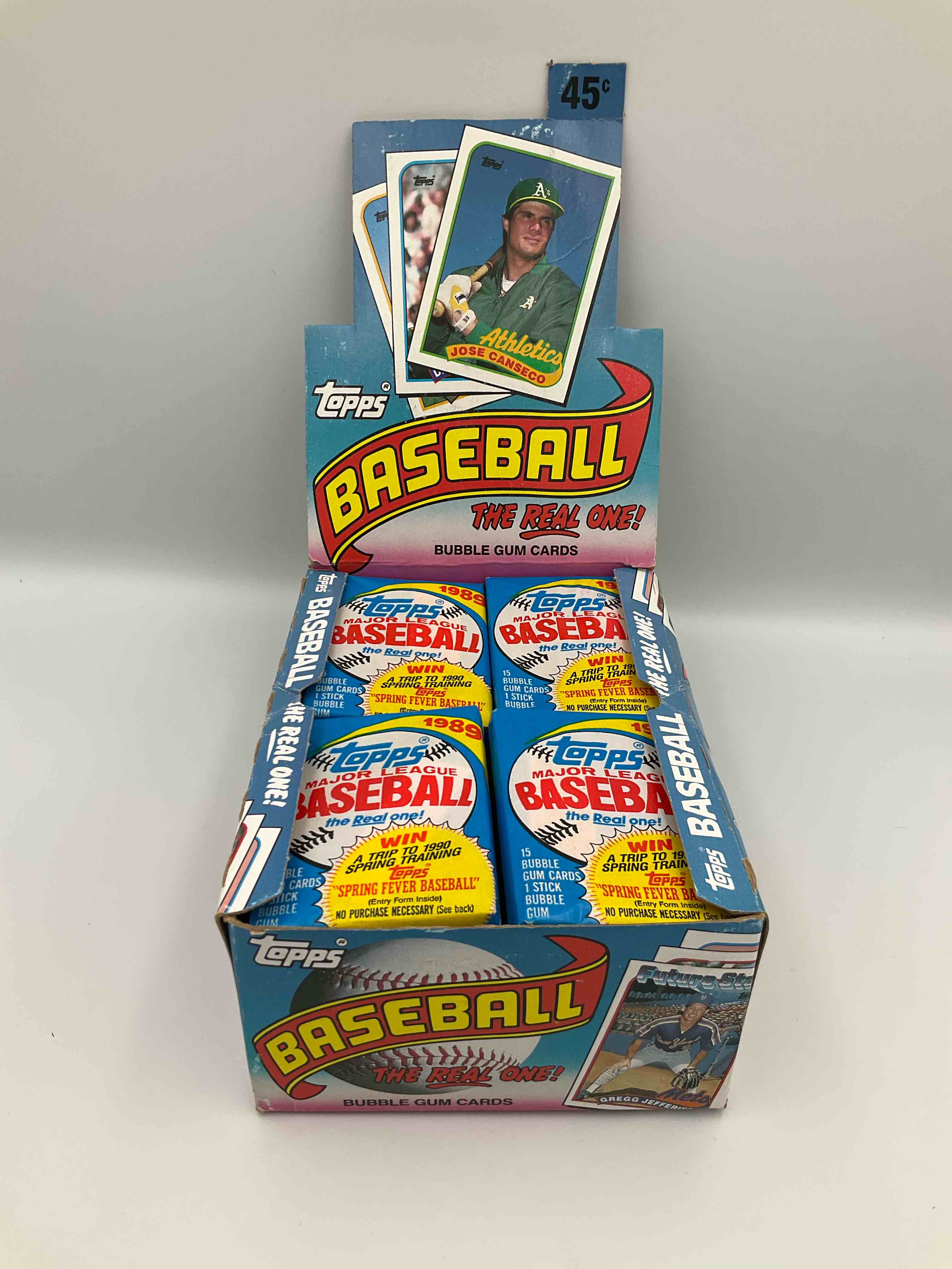 Condition photo showing New/Like New for john smoltz & randy johnson rookies!? 1989 topps baseball unopened sports card wax packs! direct from original retail case! search for valuable ken griffey jr. & randy johnson rookie cards as well as valuable bo jackson