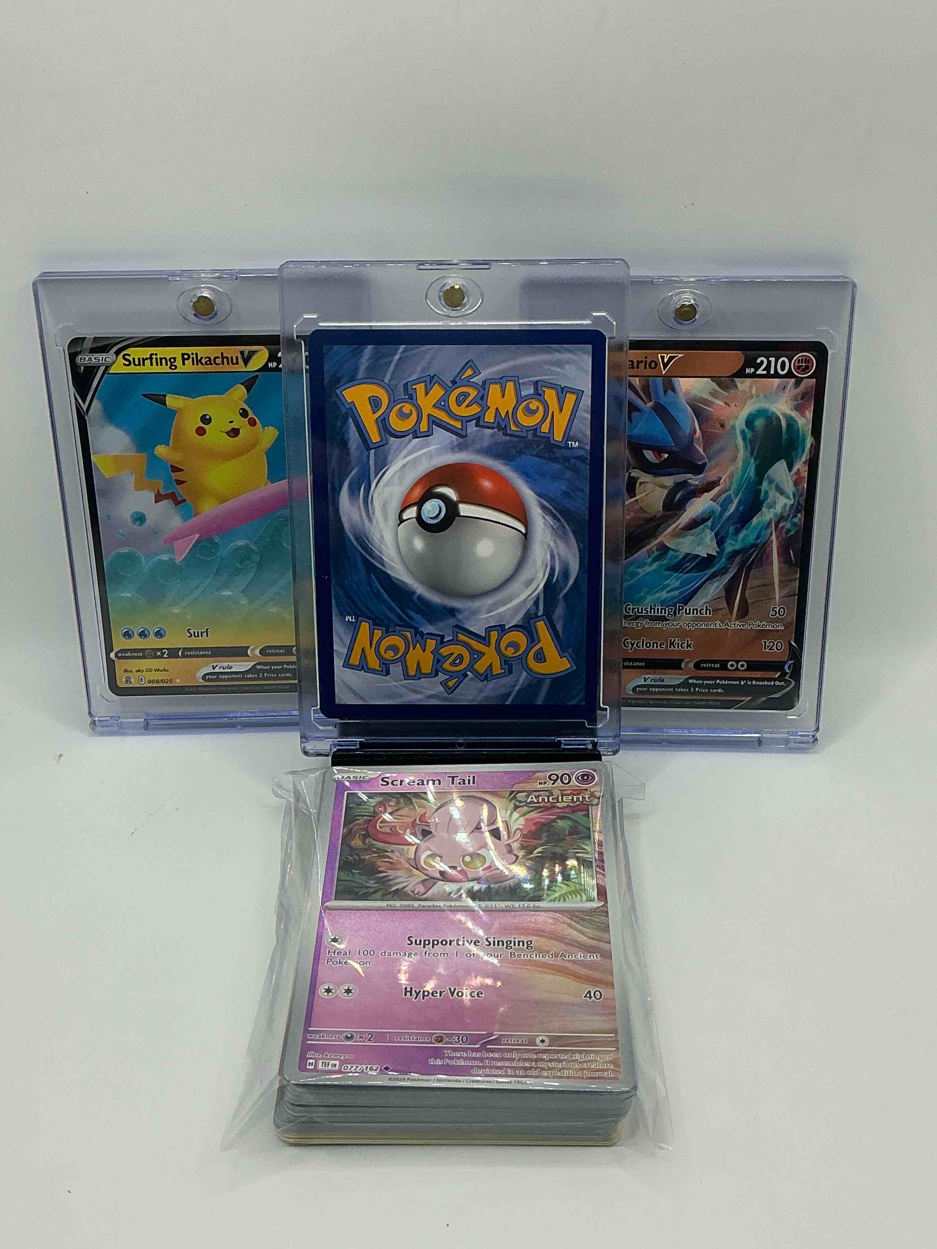 Condition photo showing New/Like New for surfing pikachu v! lucario v! flareon v! along with 50 other pokémon heroes, holos, legends & commons- including holographic cards, cool holos & more! includes 36 non holo common/ uncommon basic & first stage cards & could even include trainers & energy too! perfect set for collectors & enthusiasts!