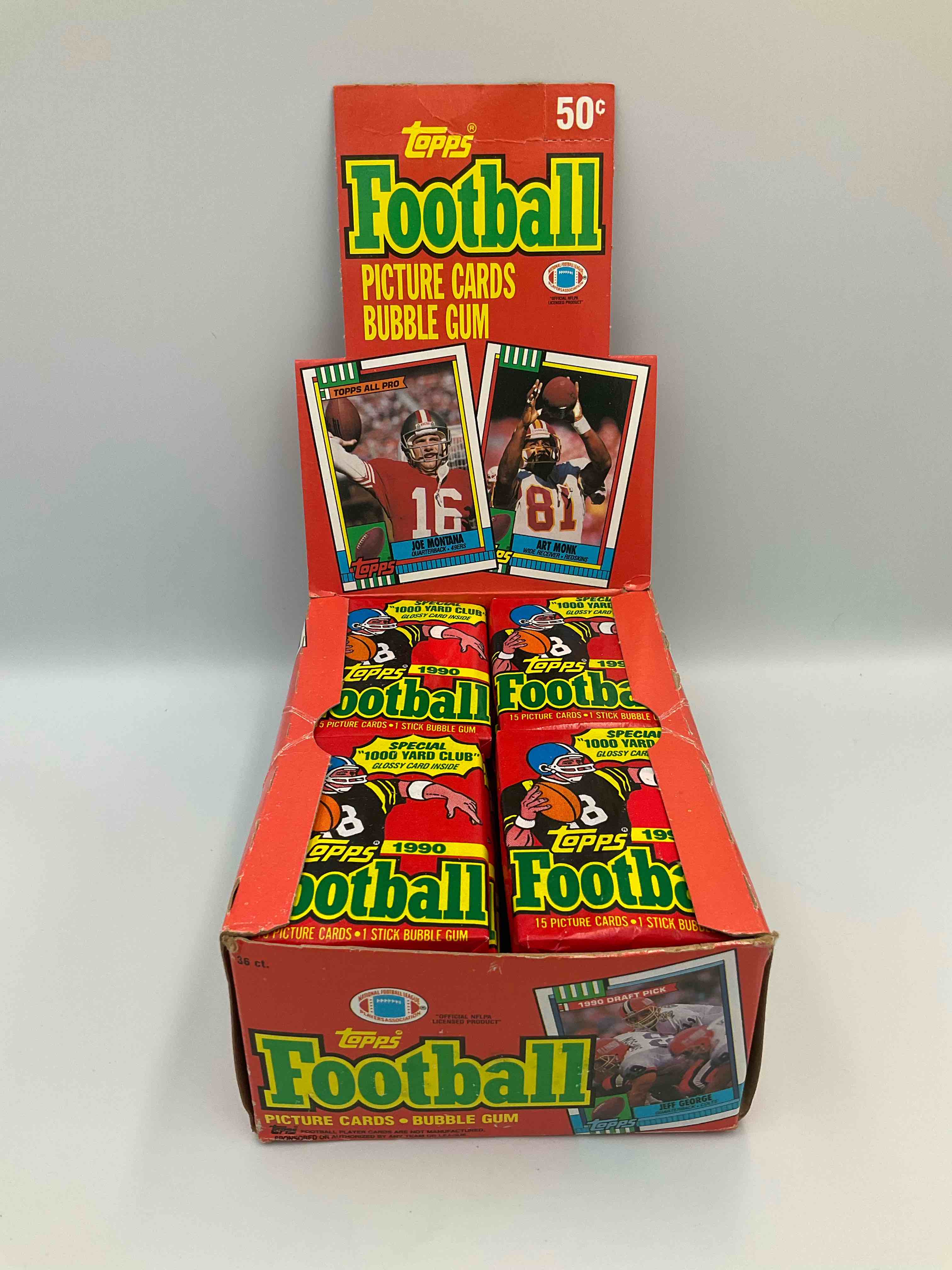 Condition photo showing New/Like New for the last year of football wax! joe montana, emmitt smith & barry sanders!? 1990 topps football unopened sports card wax pack, direct from original retail box! getting hard to find! search for early barry sanders & jerry rice & so much more!