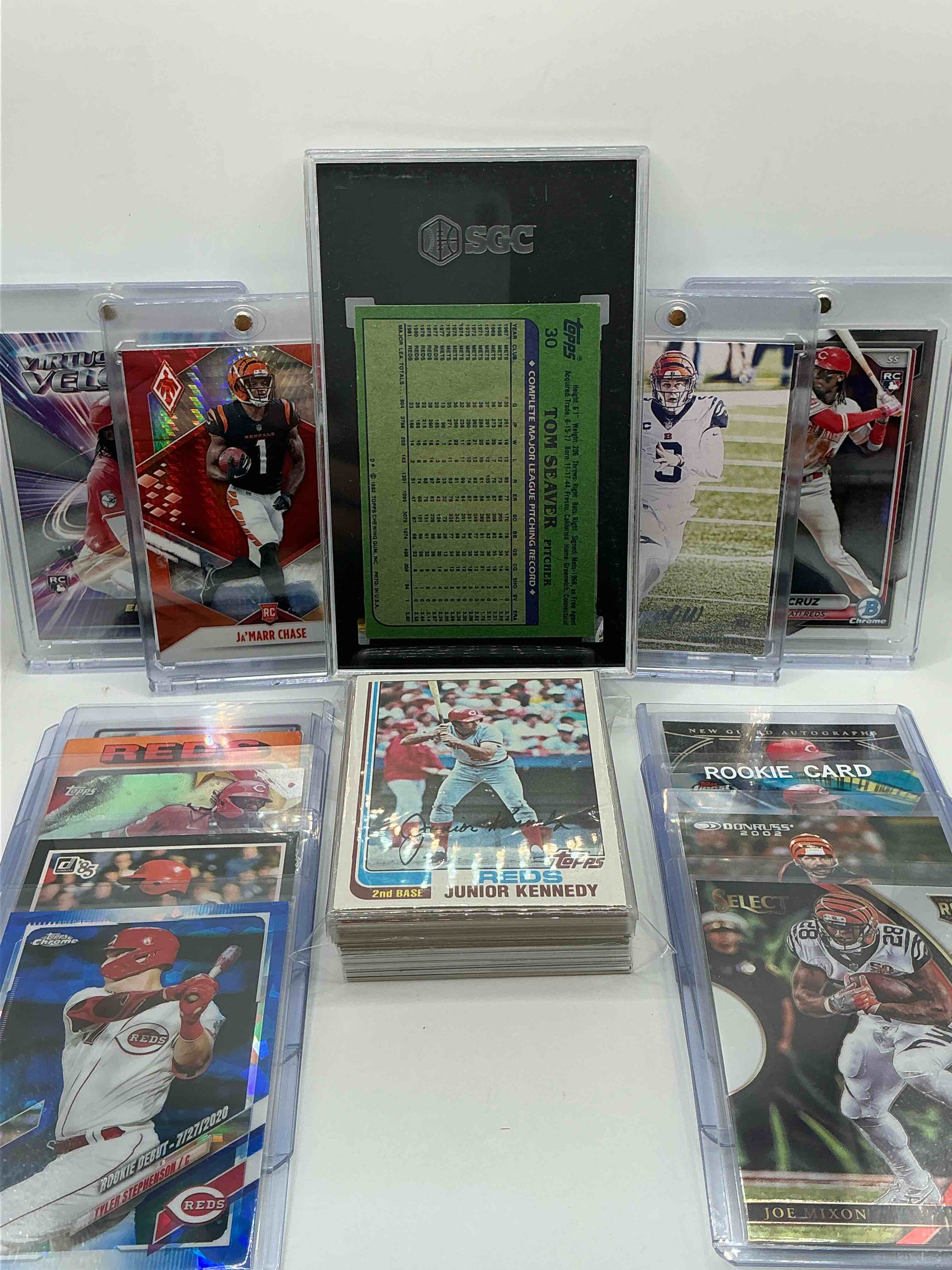 Condition photo showing New/Like New for cincinnati fans rejoice! bengals & reds 50 card craziness! so many cincinnati legends included here- tom seaver graded slab, joe burrow, ja’marr chase & elly de la cruz rookies, numbered auto, along with a crazy assortment of bengals & reds legends, heroes & commons! vintage & modern! wow!