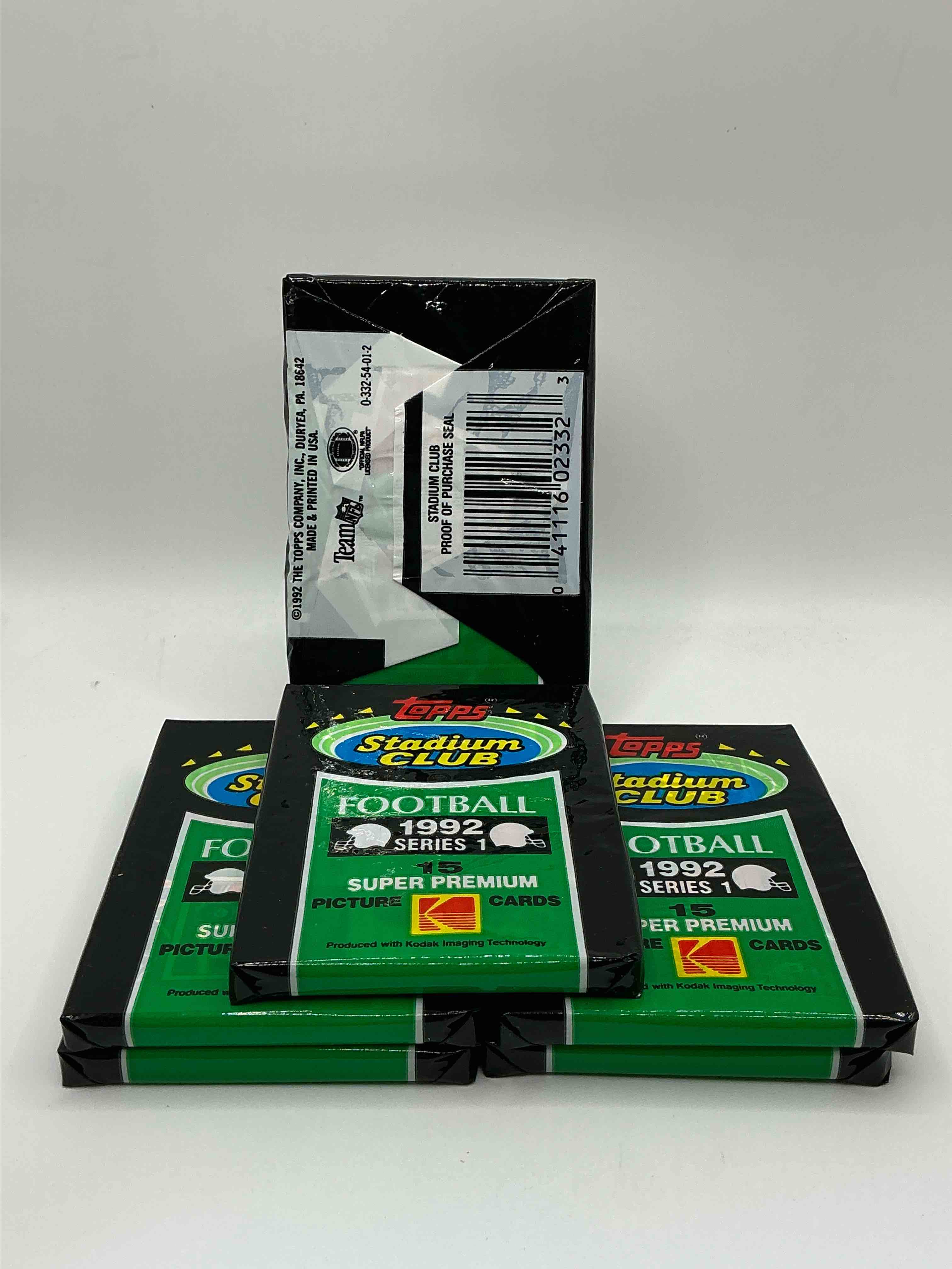 Condition photo showing New/Like New for rare! 1992 topps stadium club unopened wax pack, direct from original sealed retail case. sought after by collectors because each pack has a topps gold card! search for tons of stars like montana, rice, barry sanders, emmitt smith & so much more!