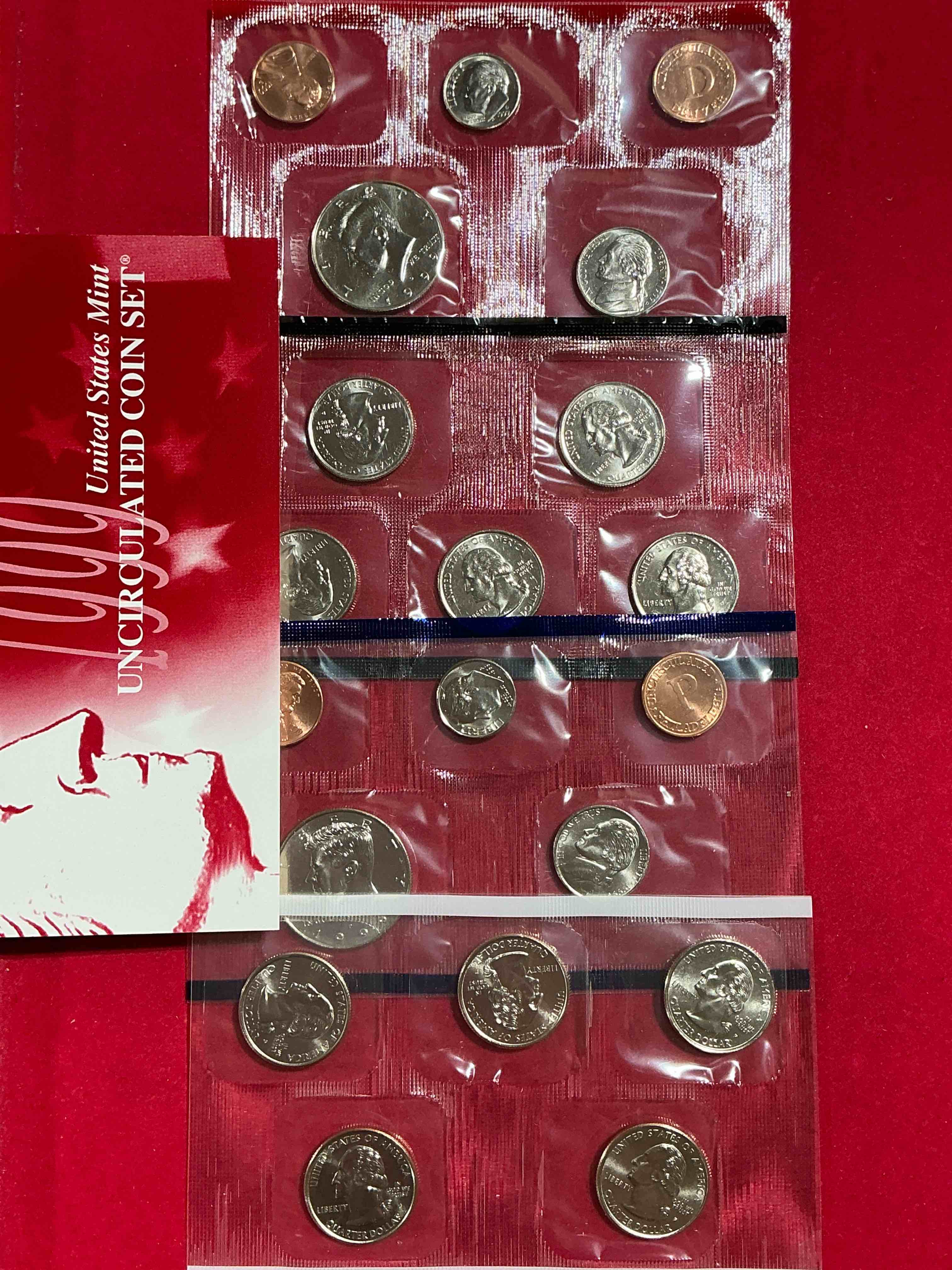 Condition photo showing New/Like New for 1999 uncirculated mint set coins! 20 coin mint set from philadelphia & denver! 20 coin uncirculated lot, with quarters, nickels, half dollars, dimes, pennies & more! uncirculated coin craziness!