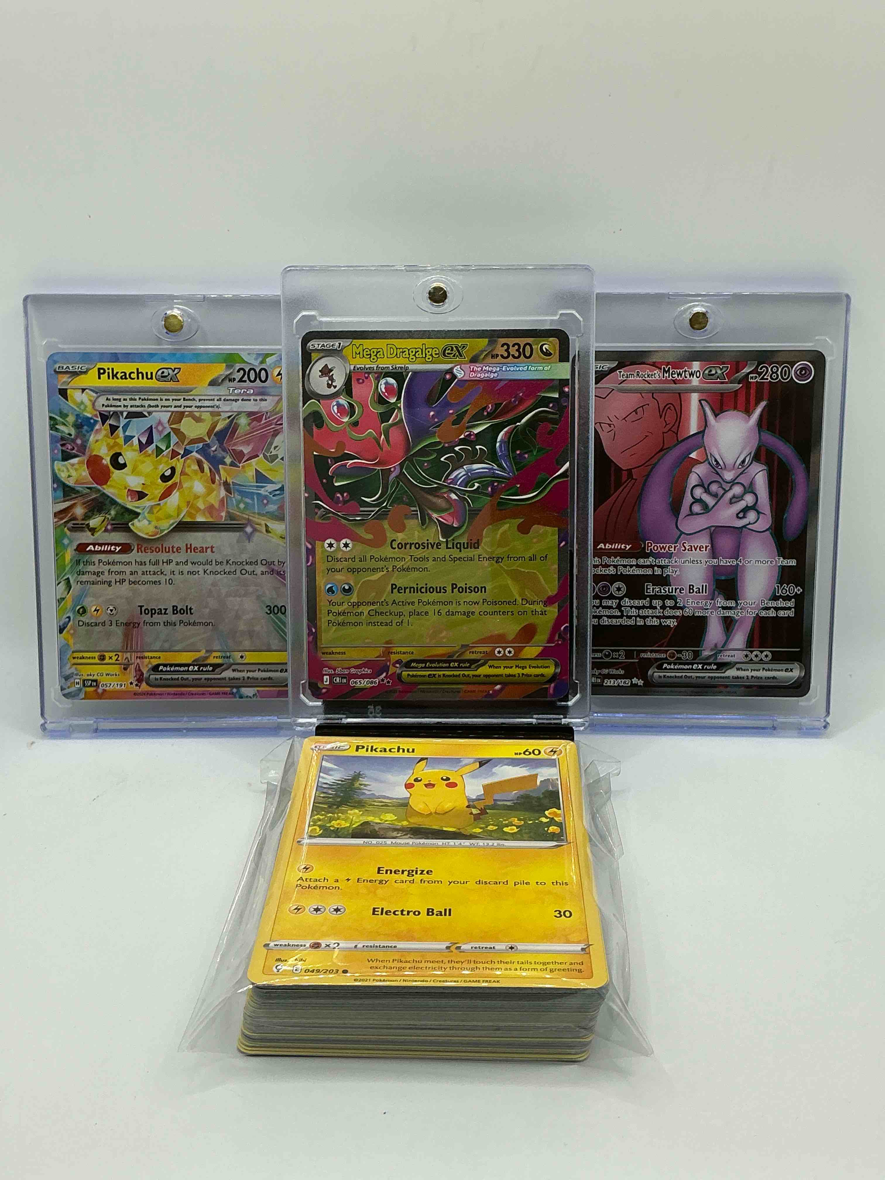 Condition photo showing New/Like New for pokémon team rocket’s mewtwo ex! mega dragalge ex! pikachu ex! along with 50 other pokémon heroes, holos, legends & commons- including holographic cards, cool holos & more! includes non holo common/ uncommon basic & first stage cards & could even include trainers & energy too! perfect set for collectors & enthusiasts!