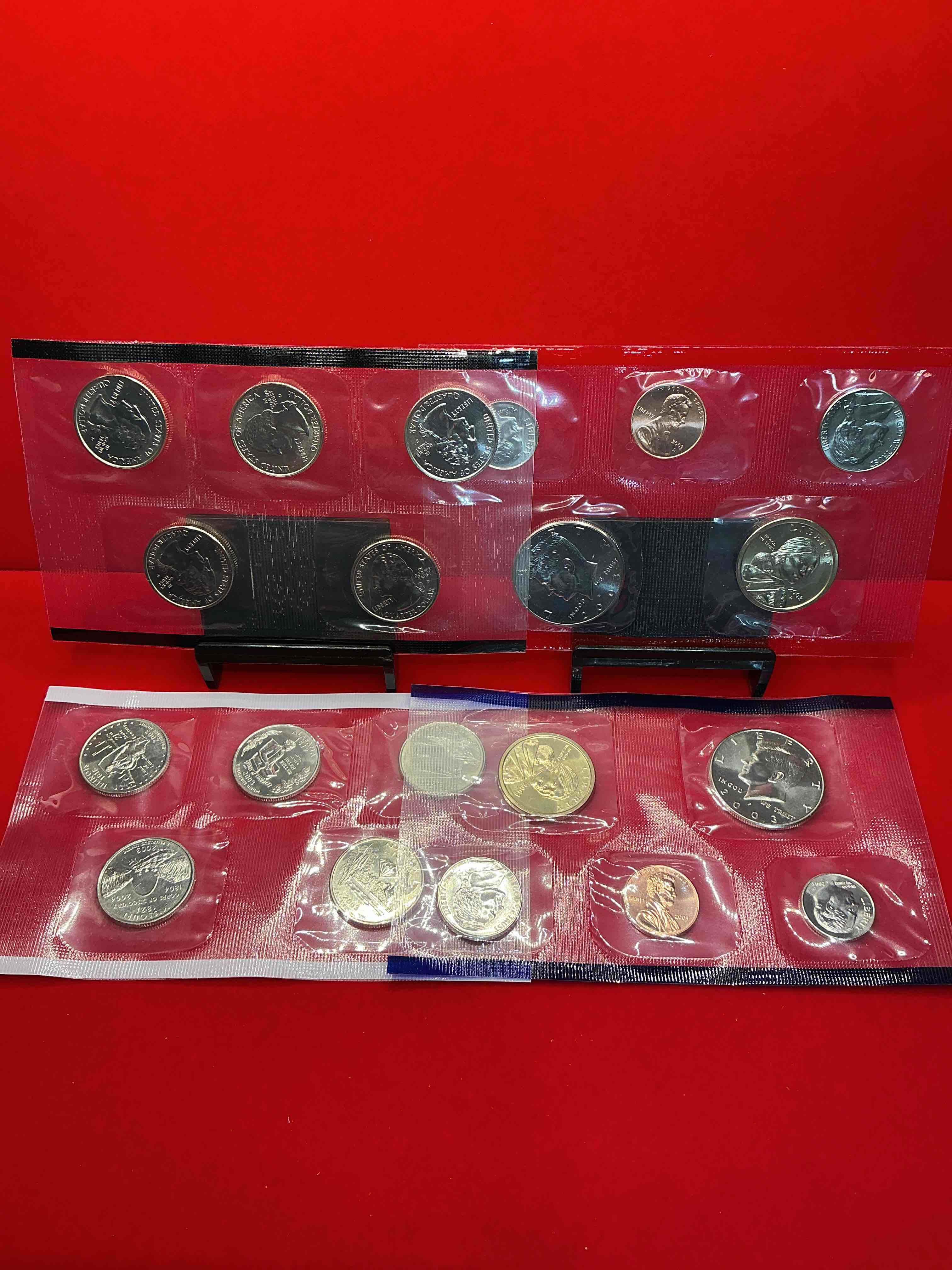 Condition photo showing New/Like New for 2003 uncirculated mint coins! 20 coins from philadelphia & denver! 20 coin uncirculated lot, with state quarters, nickels, half dollars, dimes, pennies & more! uncirculated coin craziness!