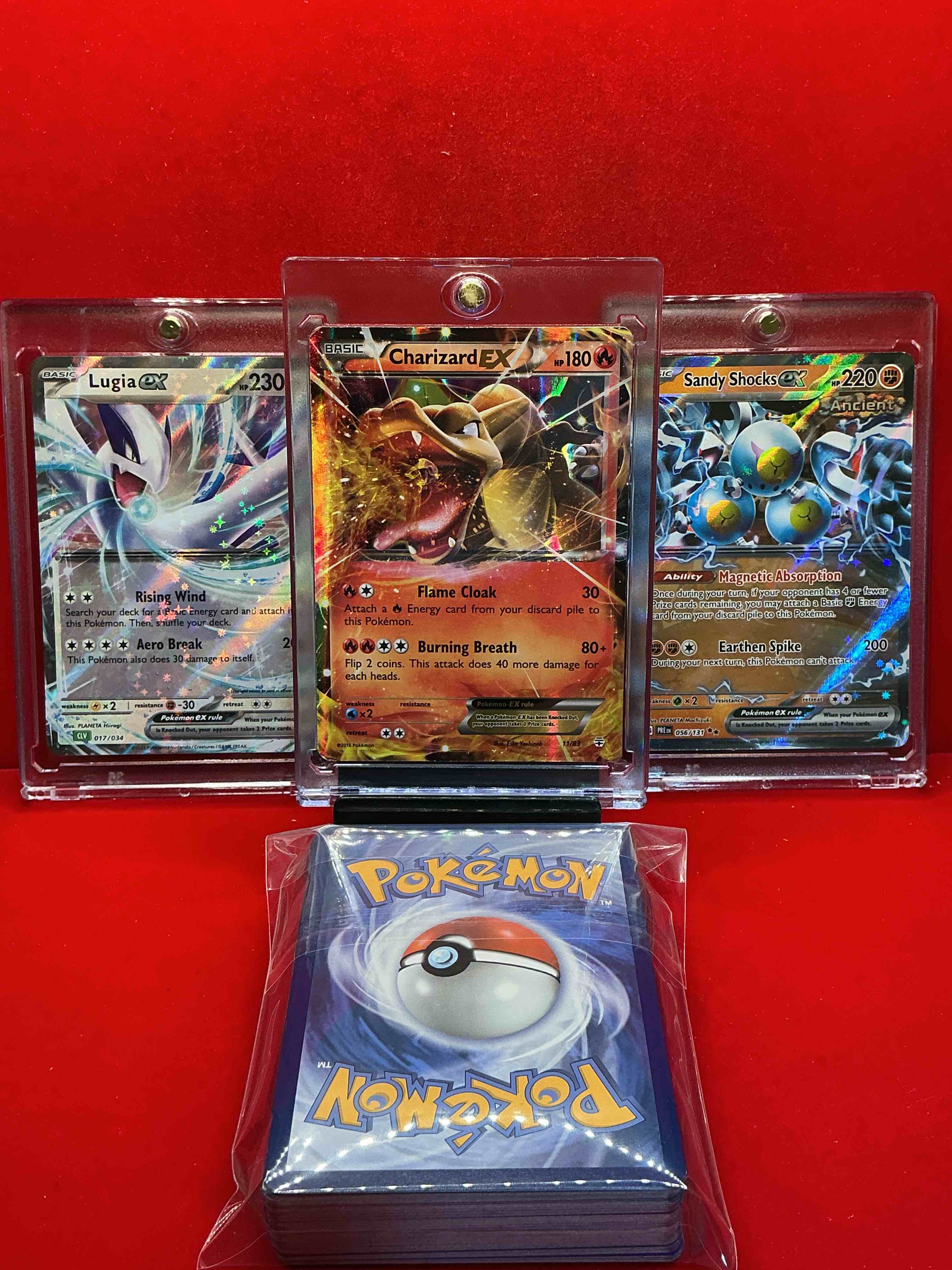 Condition photo showing New/Like New for pokémon! charizard ex! lucia ex! sandy shocks ex! along with 50 other pokémon heroes, holos, legends & commons- including holographic cards, cool holos & more! includes non holo common/ uncommon basic & first stage cards & could even include trainers & energy too! perfect set for collectors & enthusiasts!