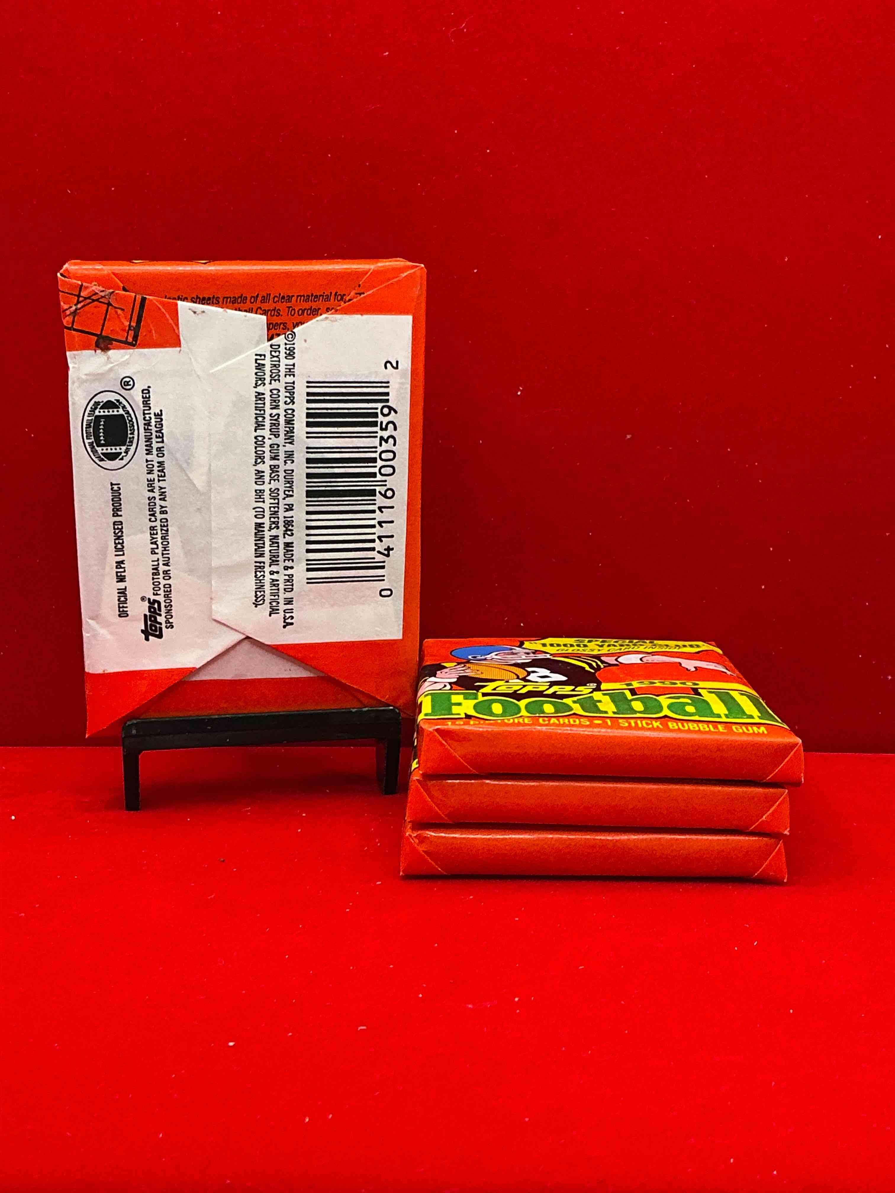 Condition photo showing New/Like New for the last year of football wax! joe montana, emmitt smith & barry sanders!? 1990 topps football unopened sports card wax pack, direct from original retail box! getting hard to find! search for early barry sanders & jerry rice & so much more!